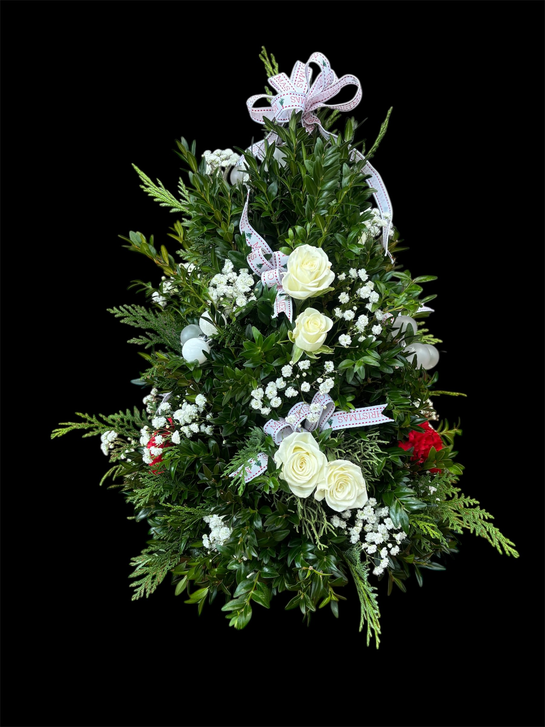 Snow Kiss - Beautiful arrangement, with mini white ornaments, white spray roses, and red carnations.