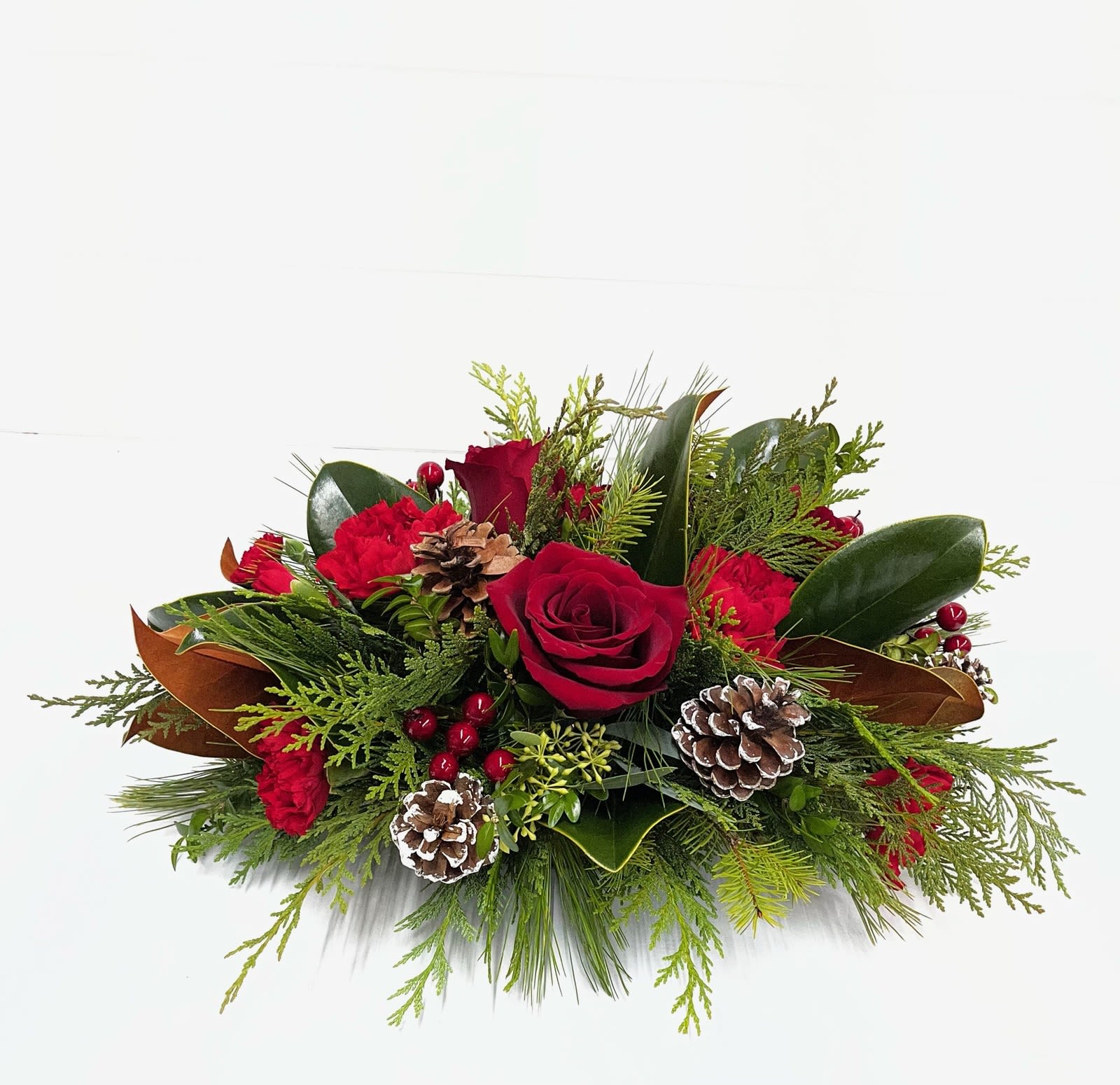 Spirit of the Season - Spread the spirit of the holiday season by sending this lovely holiday arrangement to the home of friends and family. The low profile makes it a perfect centerpiece although it will be equally at home in any room.  T120-3A