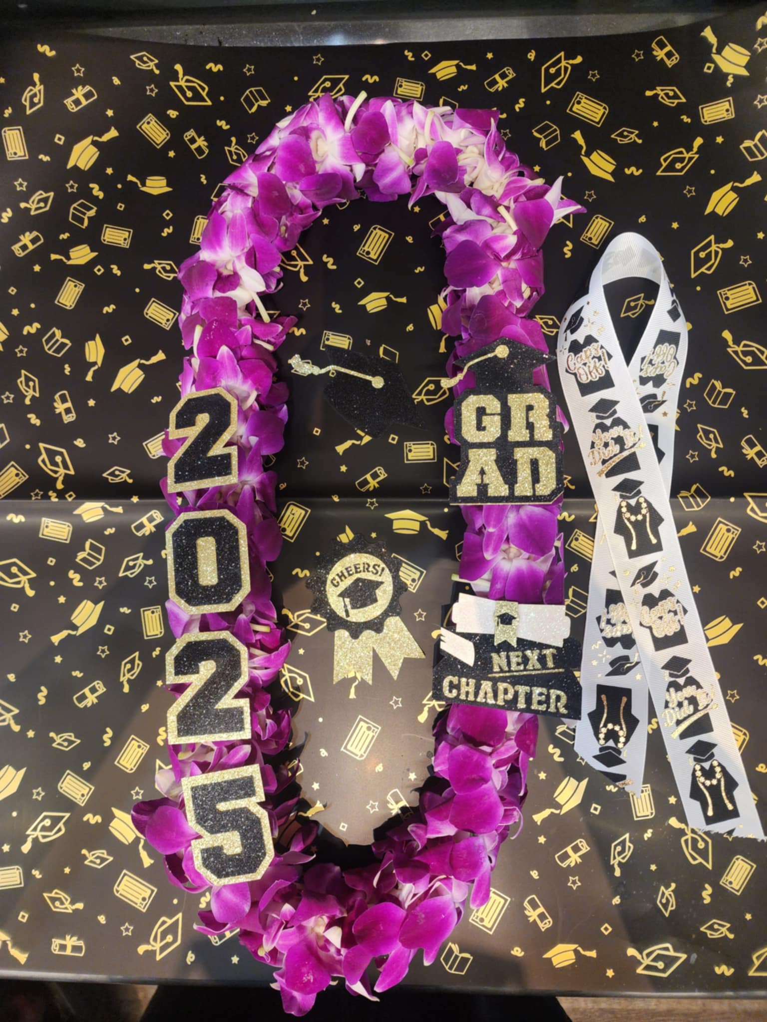 Lei With Flair For graduation 2025 - A custom double lei with glitter decals and bow
