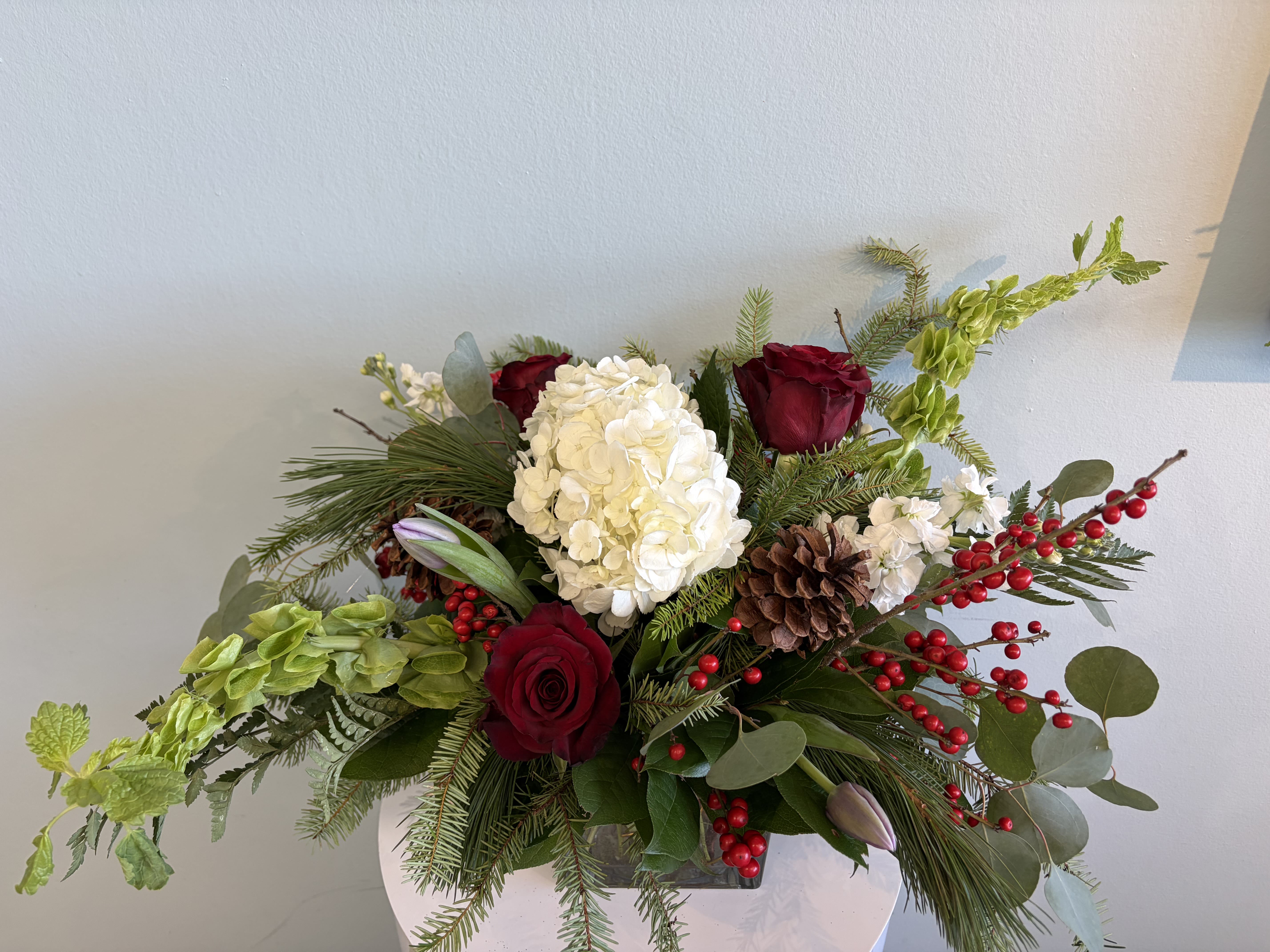 Christmas Centerpiece #2 - A festive Holiday Centerpiece for your table! This centerpiece will include a mix of red, white, and green blooms that are perfect for the Holiday season!