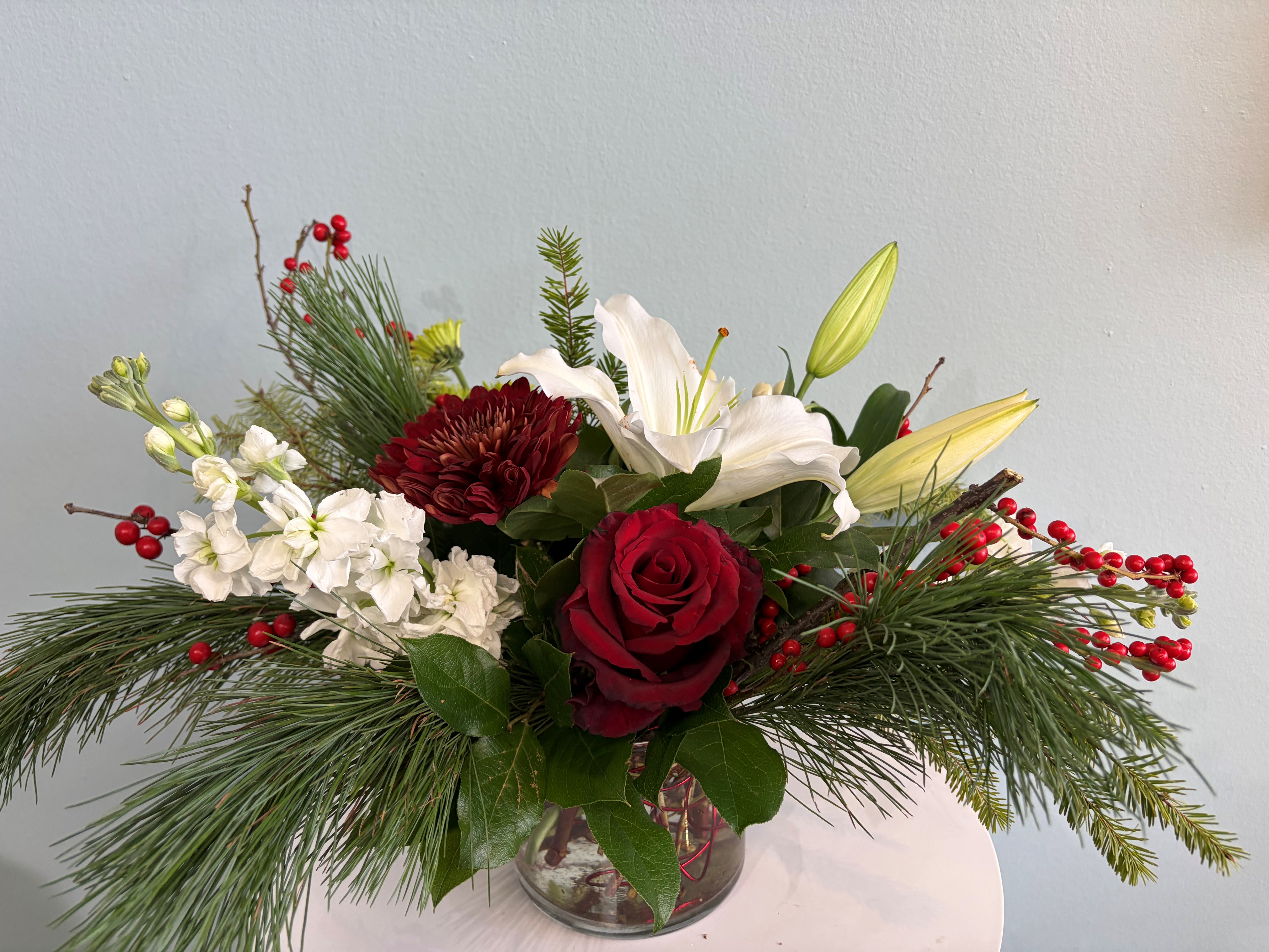 Christmas Centerpiece #5 - A festive Holiday Centerpiece for your table! This centerpiece will include a mix of red, white, and green blooms that are perfect for the Holiday season!