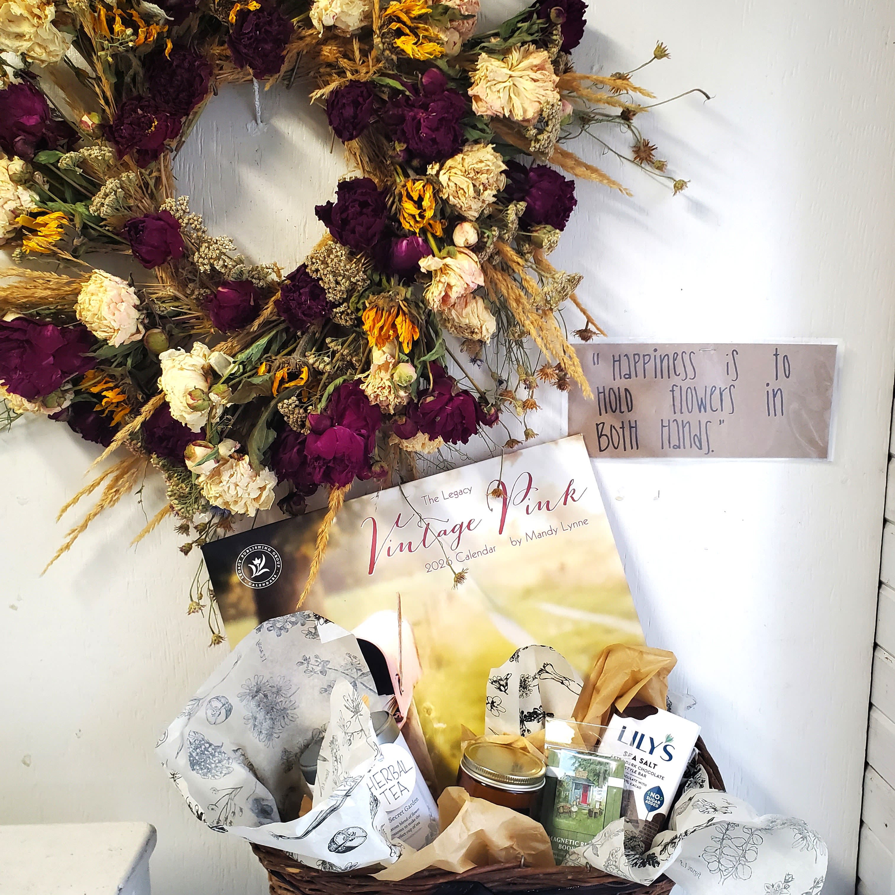 Winter Day Coziness  - A basket to brighten the winter glums! Herbal tea, golden hour scented candle, BeeHaven farmstand magnetic bookmark, sea salt dark chocolate, and a 2026 calendar! Light the candle, drink the tea and read your book! Along with one of our dried flower wreaths!