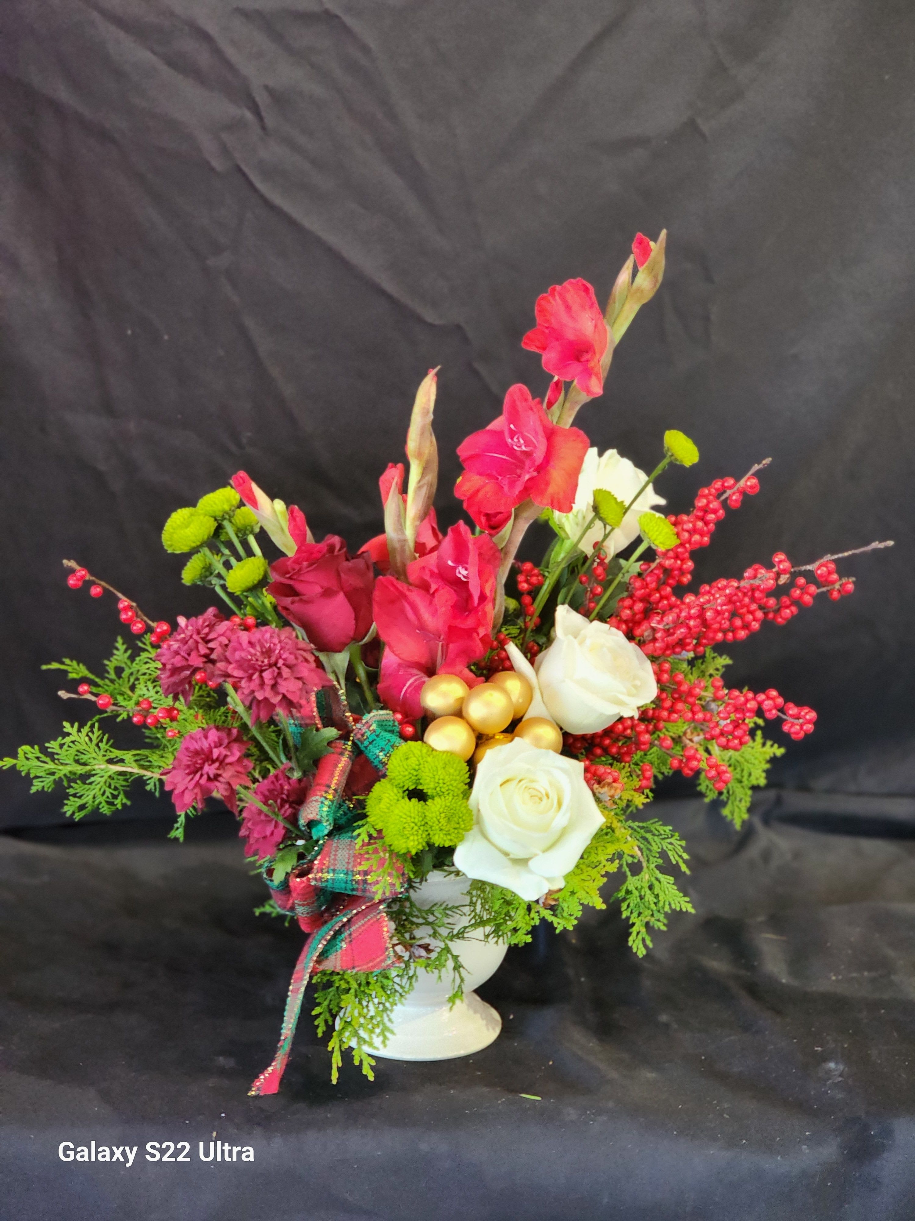 Have a Berry Christmas  - Bring in Christmas cheer with an elegant arrangement of red, white and green flowers. Deluxe and Premium will contain Dahlias or Peonies, if available.