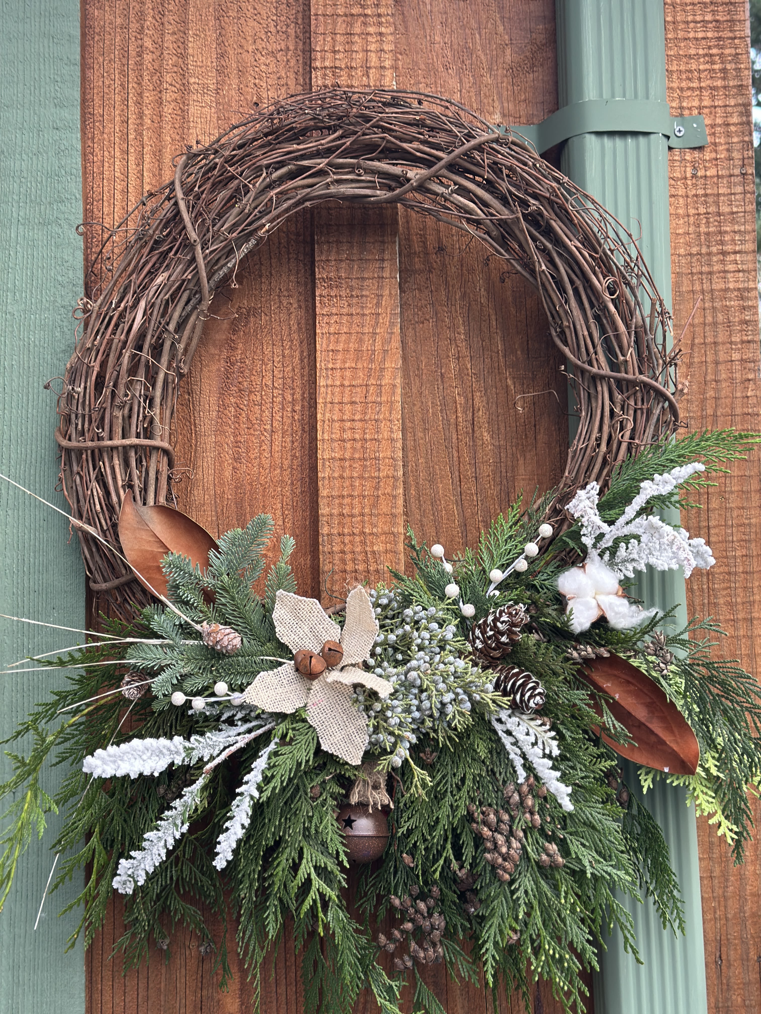 18” Grapevine wreath  - Festive grapevine holiday wreath . Shown in deluxe 18” standard price includes a 14” base. 