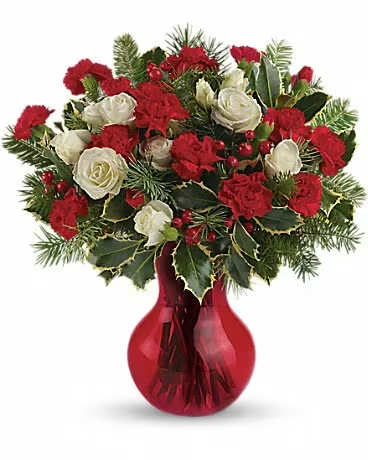Teleflora's Gather Round Bouquet - Featuring a wondrous assortment of white spray roses and red miniature carnations, this sweet arrangement is presented in our red Serendipity vase. White spray roses and red miniature carnations are accented with tips of douglas fir, holly and red berry spray. Delivered in Teleflora's red Serendipity vase.