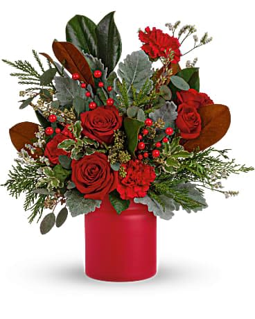 Teleflora's Wild &amp; Wonderful Christmas Bouquet - Simply unique, this gorgeous green and red design is artfully hand-arranged in a timeless matte red vase. Red roses, red carnations are surrounded by velvety dusty miller and various seasonal greens create an eye-catching wild &amp; wonderful look. 