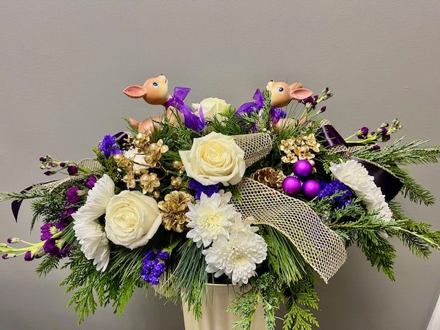 MULBERRY STREET - A different spin on the traditional holiday centerpiece. Unique, fun, and whimsical are some words we think of to describe this centerpiece. 