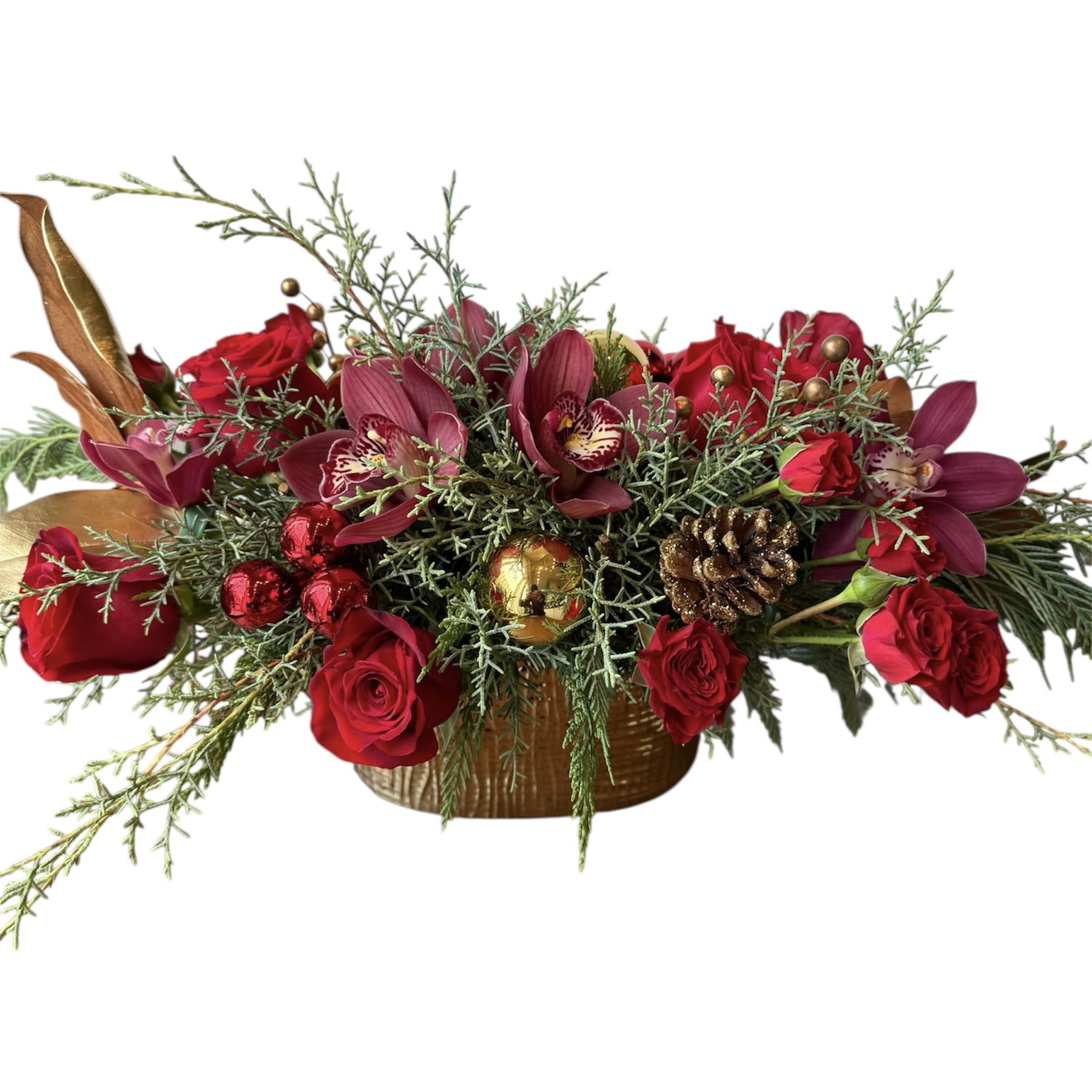 Christmas Red &amp; Gold Centerpiece  - Red roses, red spray roses, red cymbidium orchids, holiday greens and holiday decor designed in a gold pot. As shown in photo.