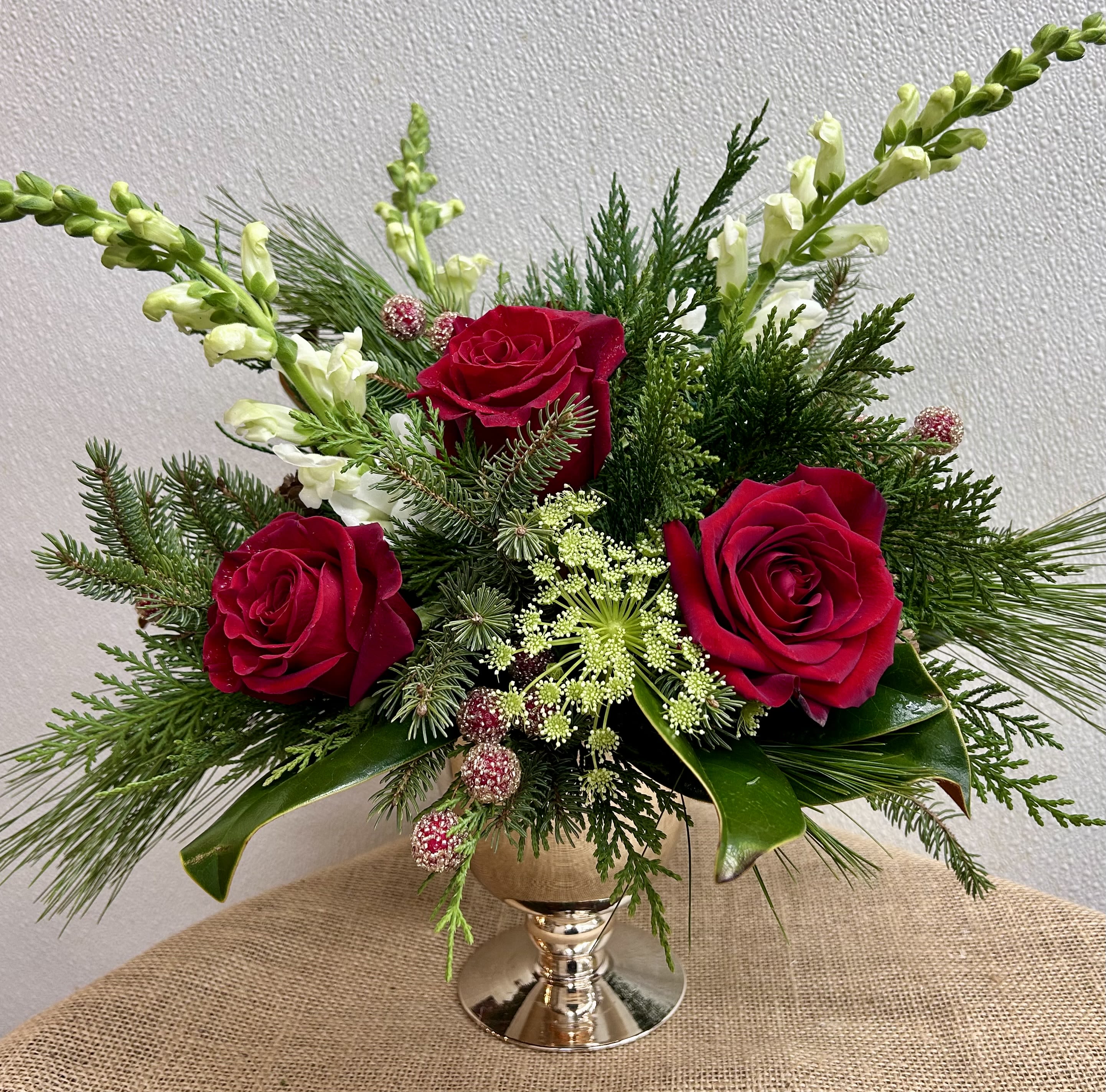 Fireside Chat - Assortment of winter greens and florals and berries in a beautiful gold compote