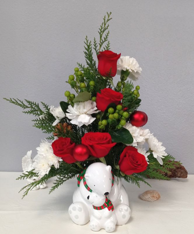 Christmas Polar Bears - Share the joy and wonder of the season with this radiant keepsake and festive blooms with fragrant winter greens, features fresh pine, miniature roses, snow-white button pompons, white statice, or similar seasonal flower favorites