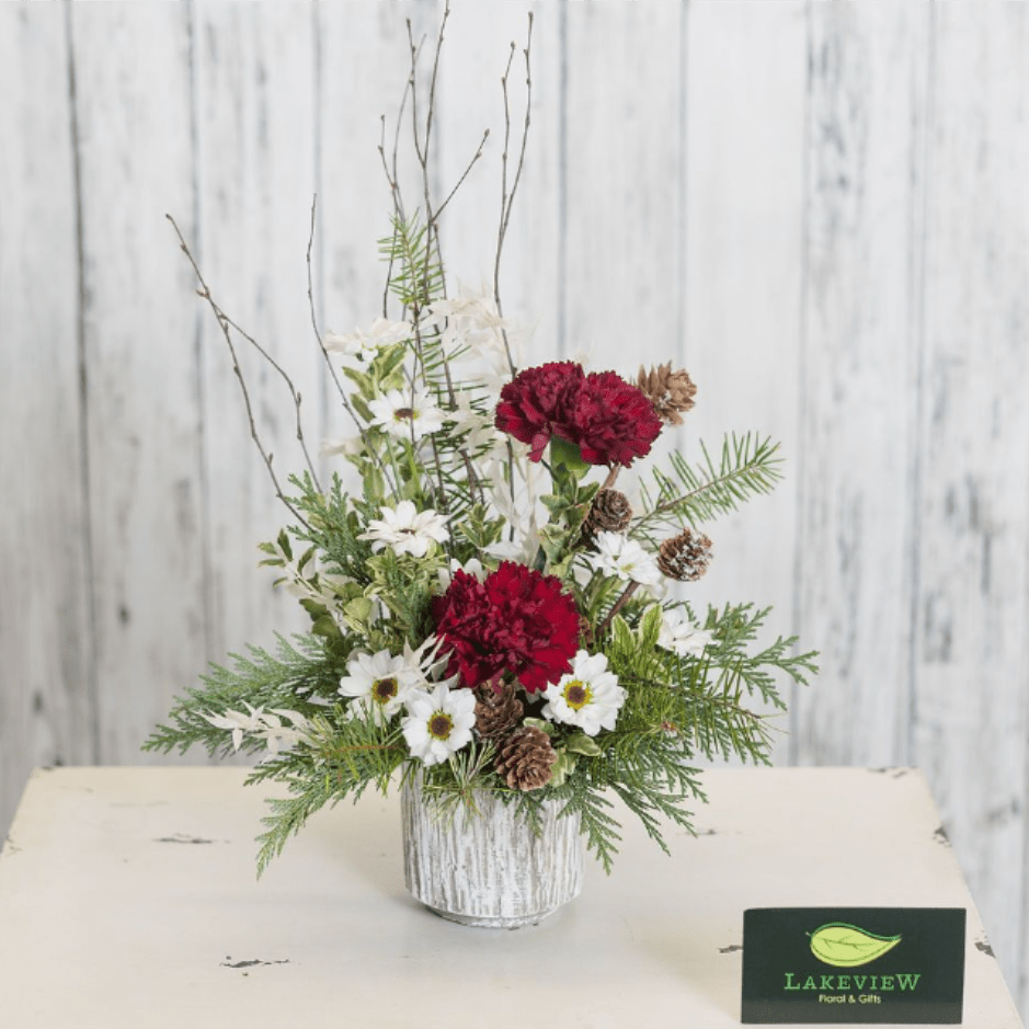 Sage - Perfect for a dining table, desk or dorm room this low profile arrangement features long-lasting mums and carnations in a woodland ceramic container.  Approximate Dimensions: 10" T x 8" W 