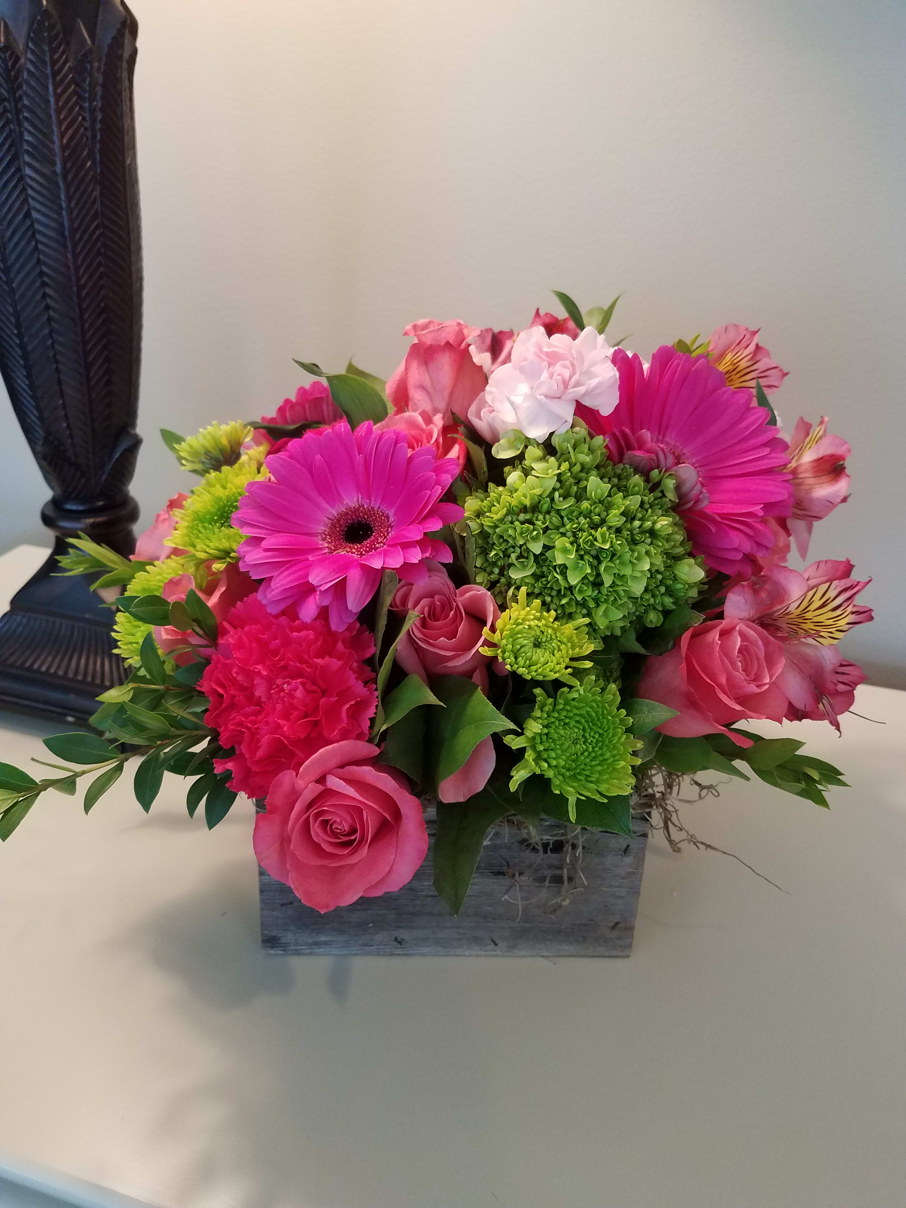 Perfectly Pink  - A mounded, lush design of fresh flowers in hues of pink with a touch of green. Designed in a Simply Flowers original handcrafted  Barnwood box. 