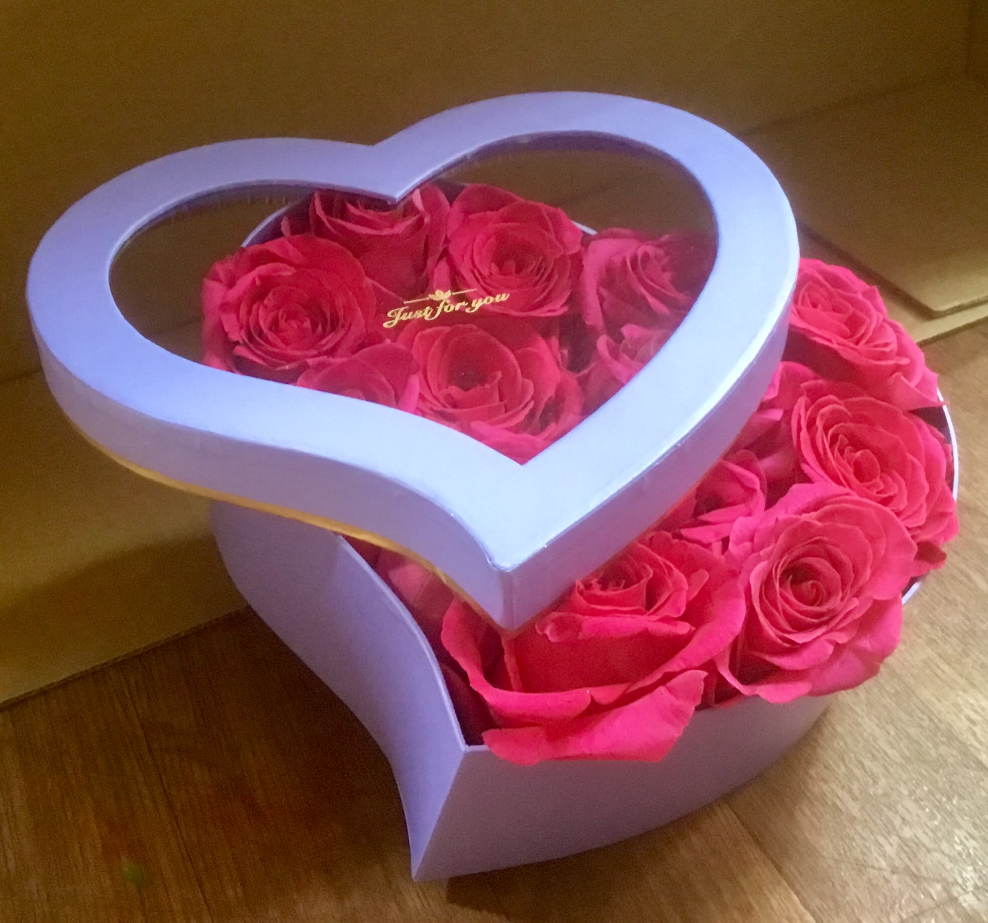  Coming to America - Heart Box of Roses: Flower Delivery San Francisco Make a romantic impression with a unique twist! Choose Jane's Roses to send flowers in our signature heart-shaped lavender box. This stunning presentation is perfect for showing deep affection.  Order flowers online to secure this memorable gift:  A Dozen Premium Roses: Select classic Red Roses for true love or vibrant Pink Roses for joy and admiration.  Unique Lavender Box: A chic, keepsake lavender box replaces the traditional vase, adding an extra element of luxury and surprise (as pictured).  Perfect for Any Occasion: Ideal for anniversaries, birthdays, Valentine's Day, or just because you want to make someone feel special.  Trust your local San Francisco florist for reliable service and exceptional quality.  Same-Day Flower Delivery SF is available! Buy online before 1:00 PM for fast flower delivery in San Francisco and the Bay Area. Shop this unique rose box now!