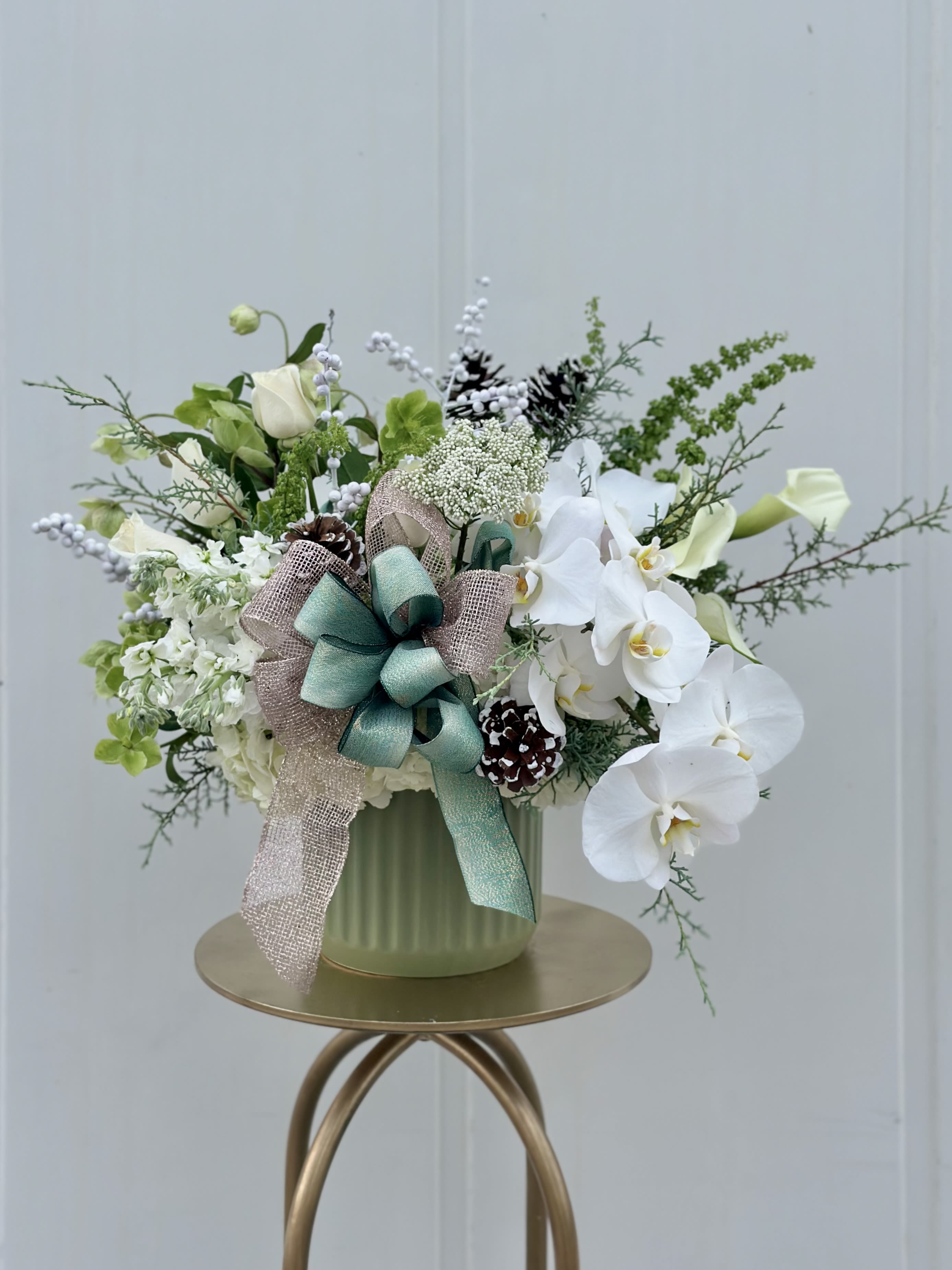 HOLIDAY SPARKLE  - Our neutral holiday floral combines some of the seasons freshest flowers in a designer compote. 