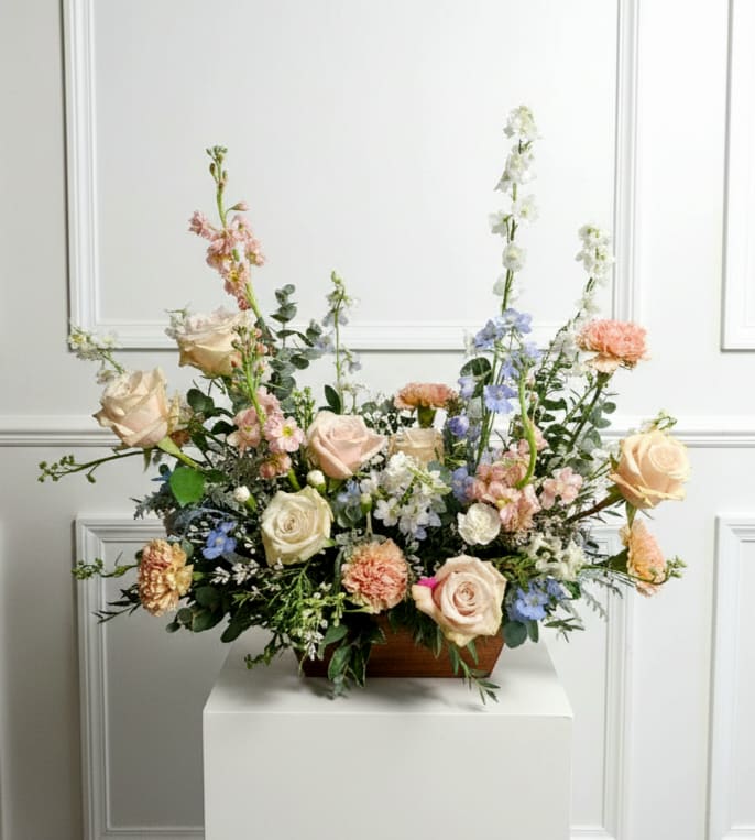 Delicate Sentiment - Soft pastels, lasting blooms combined for a truly delicate final tribute.