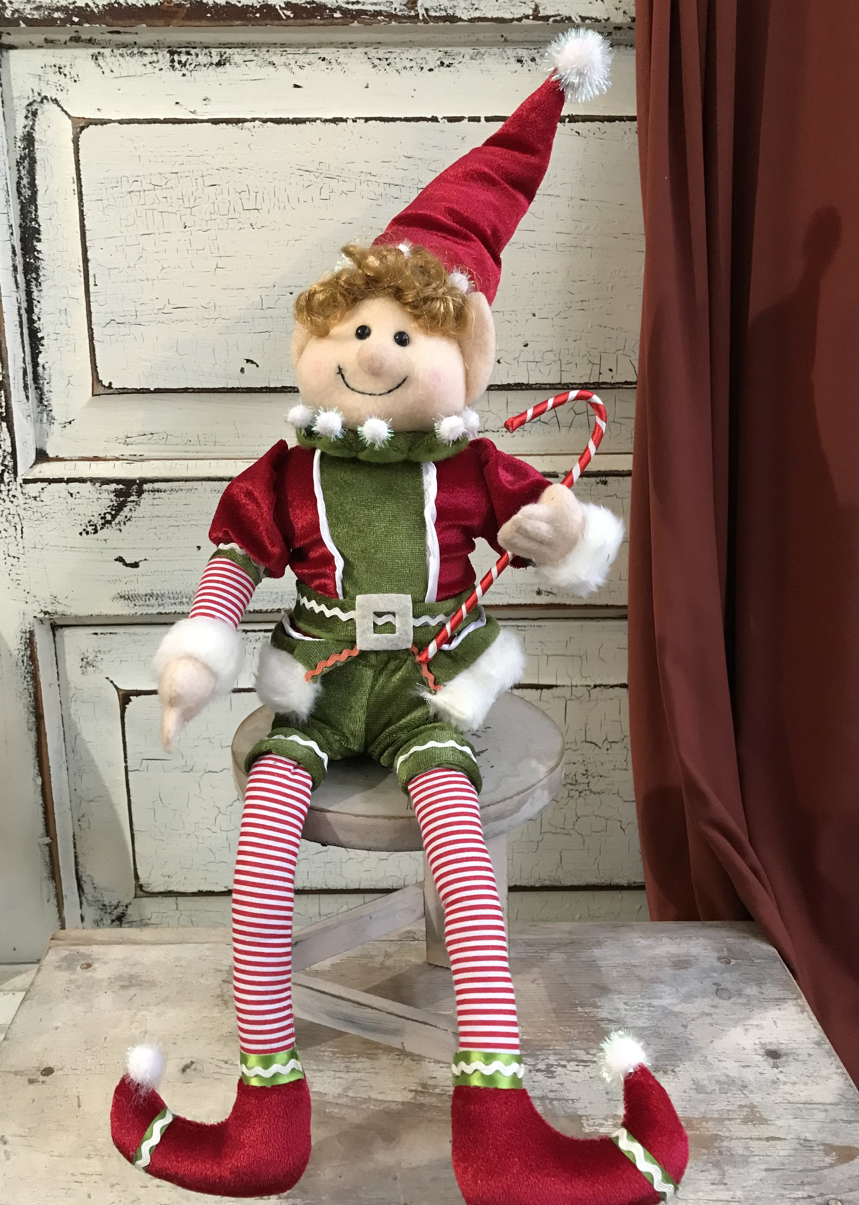 Santa's Helper (18" tall) - This adorable elf has wired limbs so that he can easily be placed atop a mantle, into the tree, on a shelf or anywhere else! Standing about 18" tall, this makes a great addition to one of our arrangements or we can deliver it as a stand alone gift in a bag with ribbon.