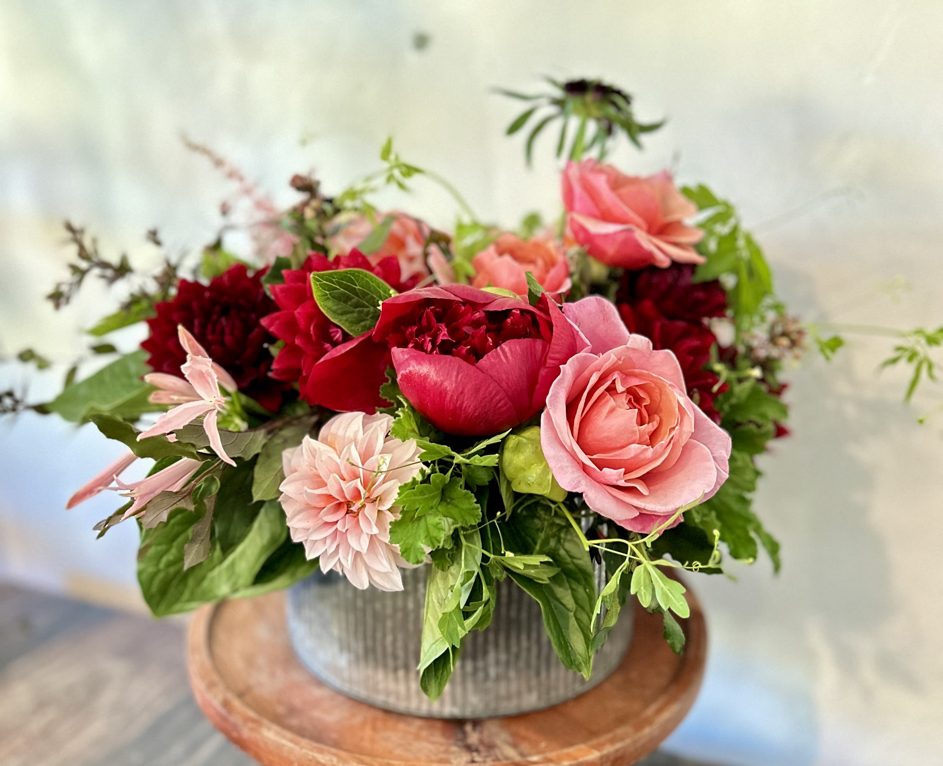 Eve. - The perfect pick-me-up for the cooler Fall /Winter days, Eve is understated yet grand, Elegant yet a little eclectic. Eve is also very, very pretty. Succumb to temptation. Choose Eve for that special occasion and make it just a little bit special-er! May include Roses, Dahlias and Seasonal Greens. 