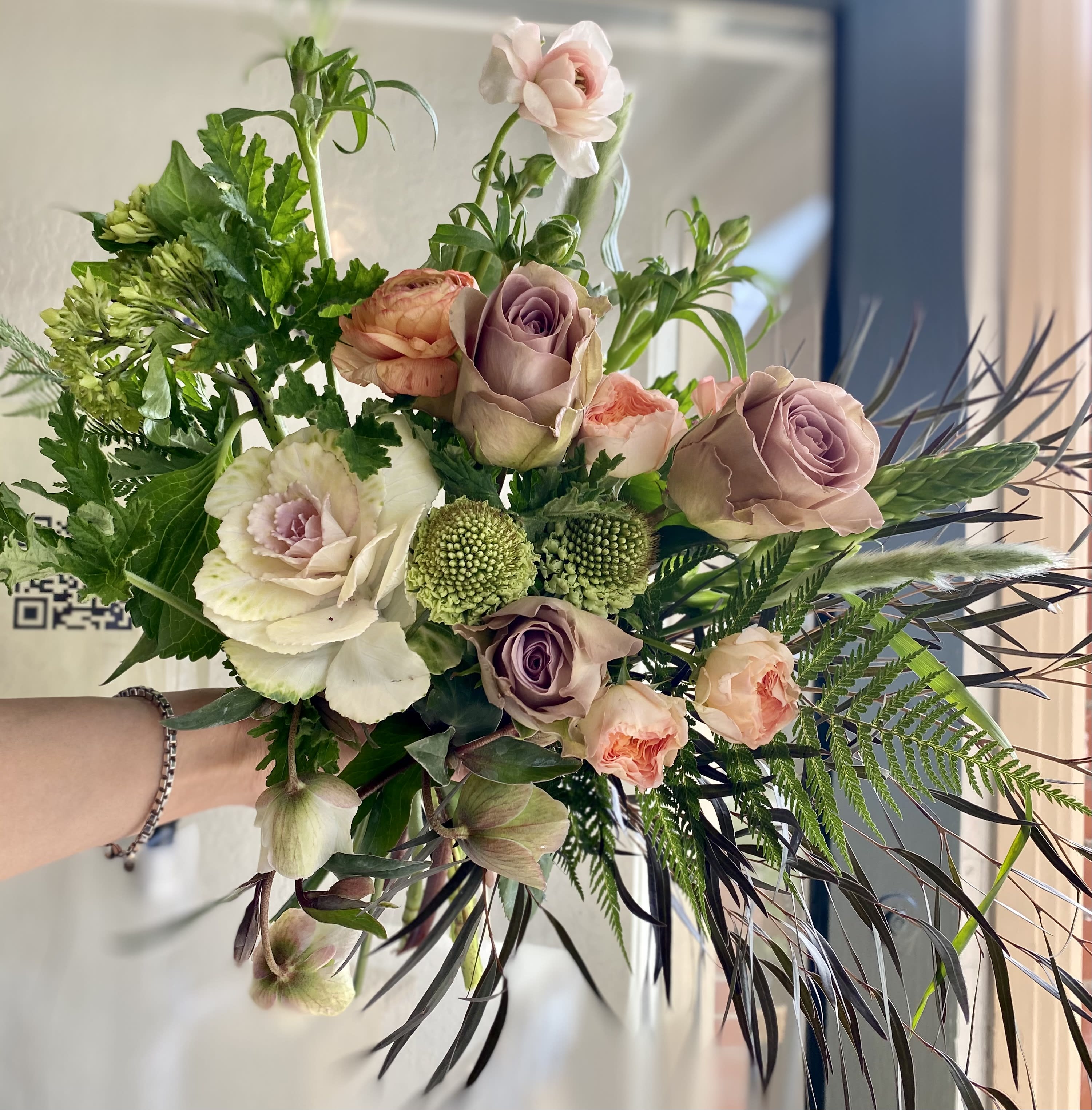 Kokoro - Flowers have a special way of expressing what is going on between us. Flowers sometimes leave the mind behind and go straight to the heart. Enter Kokoro. Kokoro means heart in Japanese and is also the name of Momo's number one Design for your love. Like Cupid, Kokoro's aim is true. The rest is up to you... May include Kale, Garden Roses, Ranunculus and other lovelies.