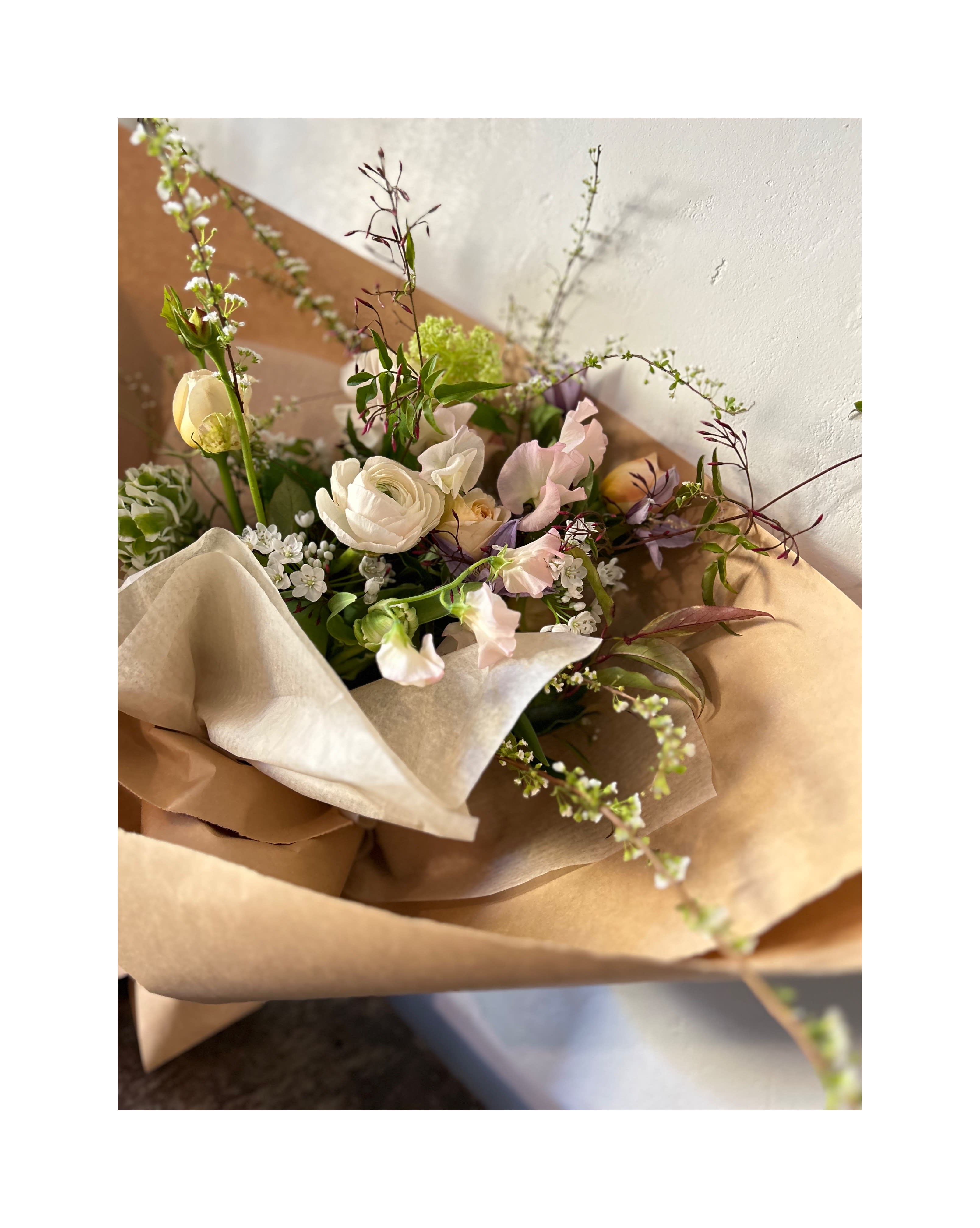 Pure and Simple. a Hand Tied Arrangement. - This one is purely and simply an expression of caring without a lot of filigree. A lovingly hand tied bouquet that simply and purely says "I am thinking of you". The flowers have no agenda. They're just dong their job: Being Lovely. Pure and Simple. Get yours today.