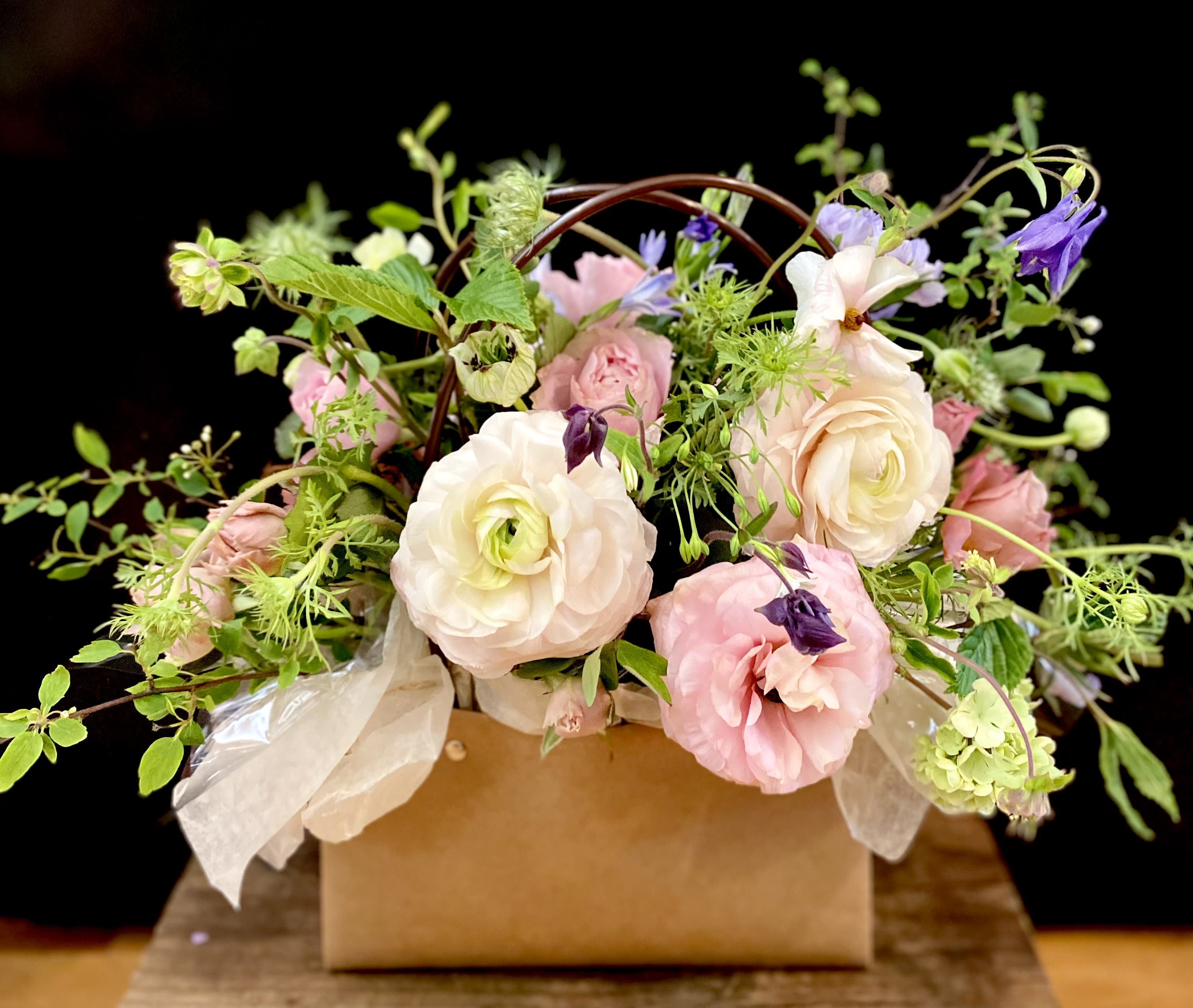 Shakespeare's Garden - "A Rose, by any other name, would smell as sweet..." Almost as if it was freshly plucked from Anne Hathaway's yard in Stratford Upon Avon, "Shakespeare's Garden" is pure poetry. Bursting forth from a kraft bag that keeps the blooms blooming longer, this arrangement is dedicated to our dear friend Patty who we know appreciated the sound of a good story as well as the smell of flowers even when her eyes failed her. A feast for the eyes, "Shakespeare's Garden" may include seasonal flowers with garden roses. 