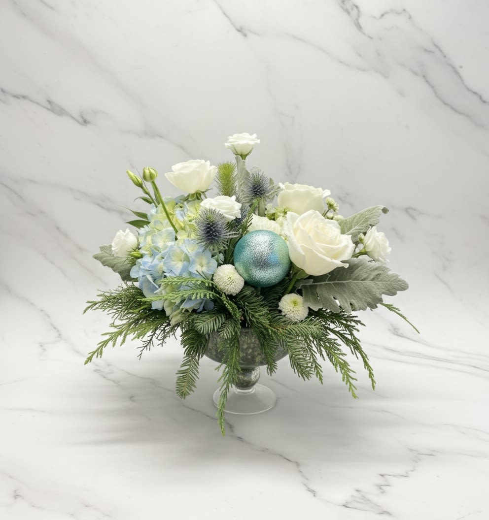 White and Blue Winter Floral Arrangement - A clean ,winter-inspired arrangement featuring white rose, soft blue flowers, and fresh greenery.