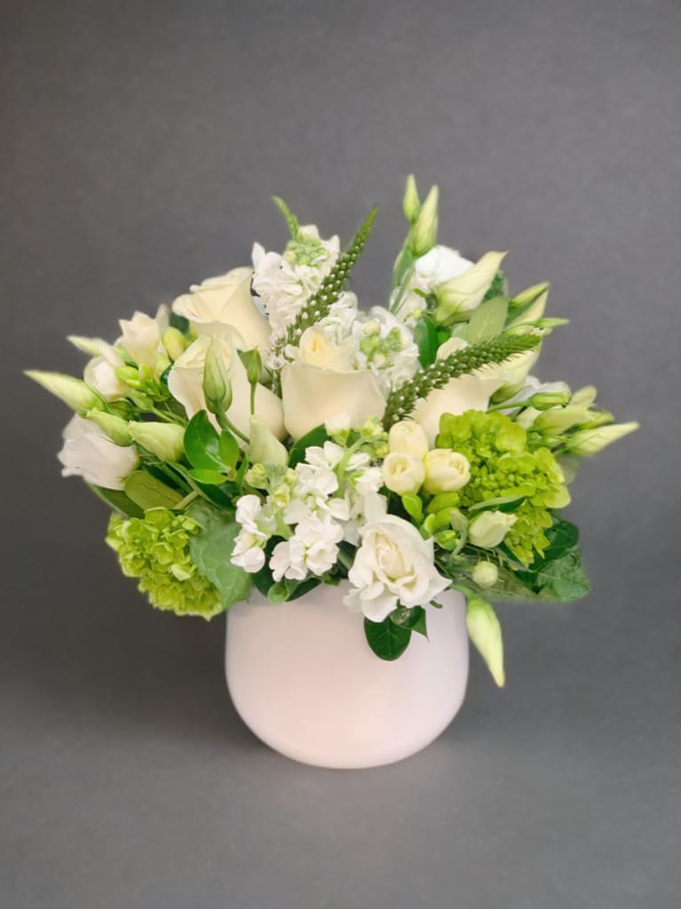 Simple Whites - Pure white flowers, in a cylinder vase, are perfect for any occasion 