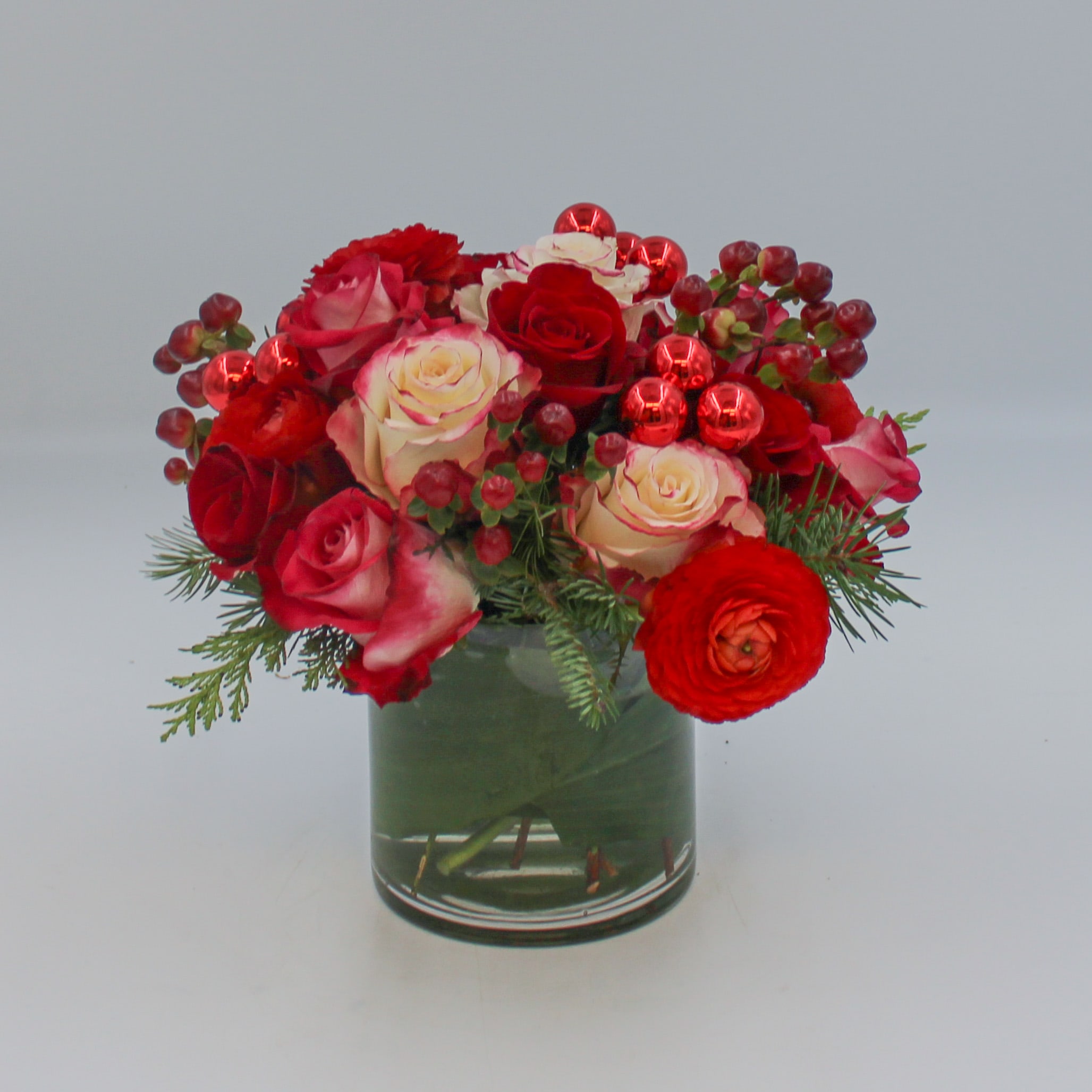 Dasher - Dasher is a classic Christmas Red and White vase arrangement in a 5 inch leaf lined clear glass cylinder. 