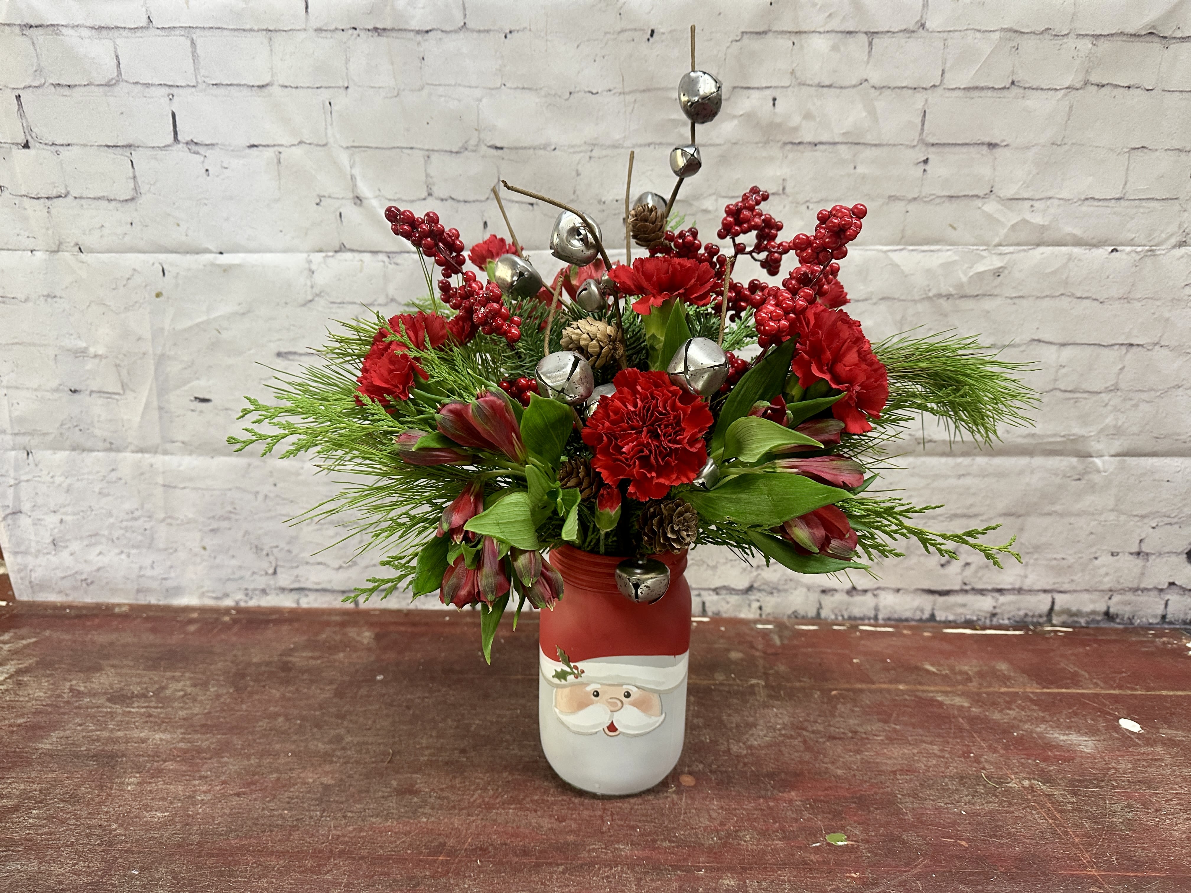 Jingle all the way - Santa mason jar with bright Christmas flowers and silver bells