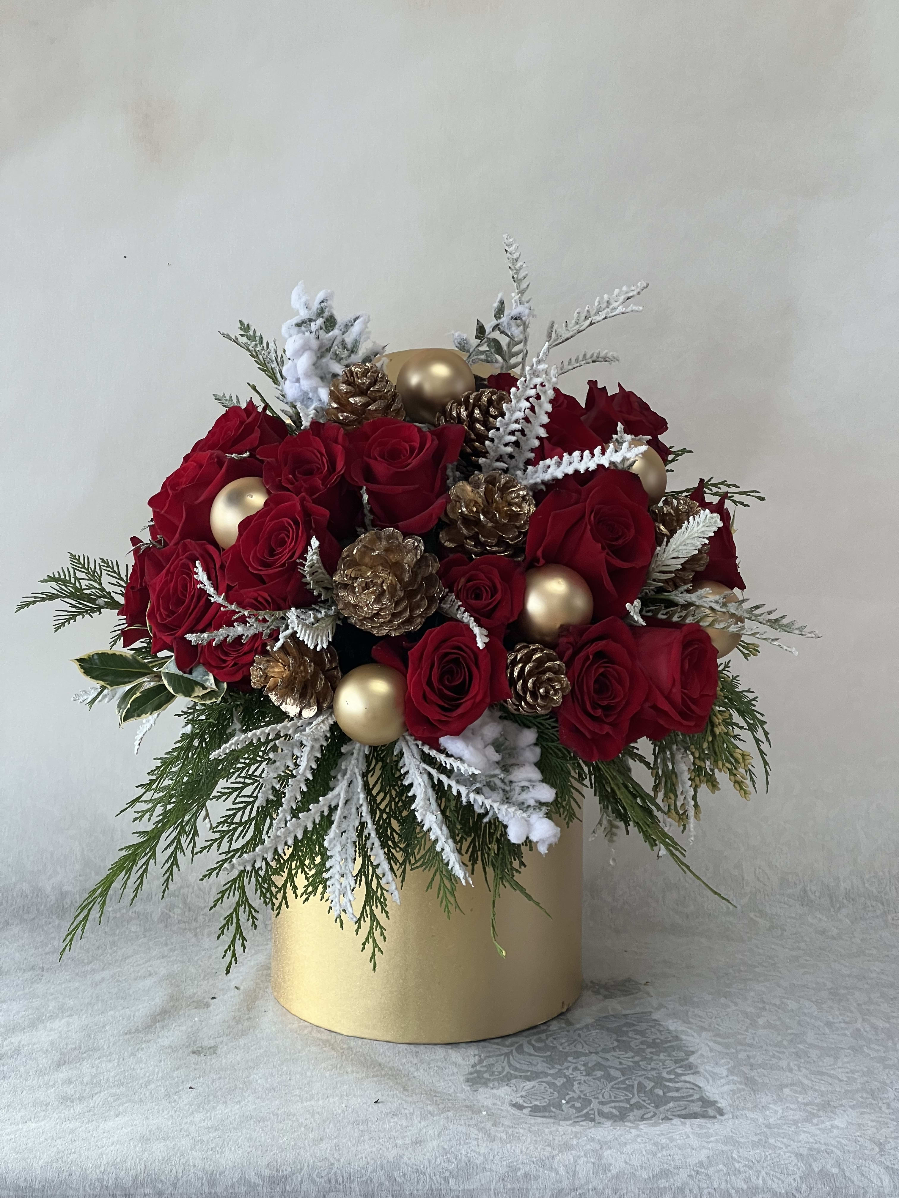 Winter wonderland  - Christmas in a Box ( including red roses and Christmas greenery, pine ones and Christmas ornaments. This gorgeous arrangement is coming with gold color ceramic 6x6 vases.)