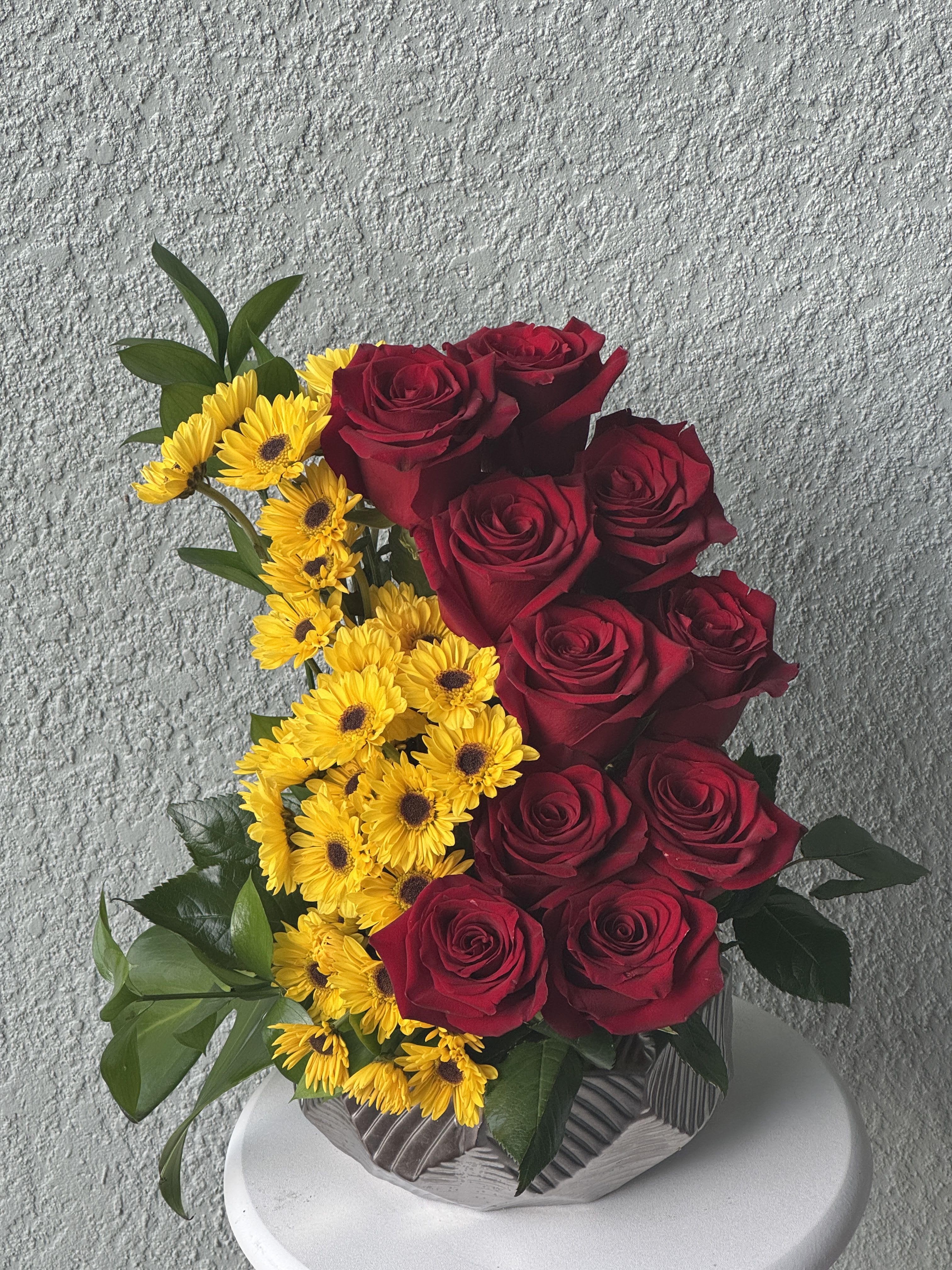 Eternal flame -  Our Sunshine &amp; Passion Bouquet features classic red roses — the timeless symbol of love — paired with charming yellow mini daisies that resemble cheerful sunflowers. This vibrant mix of romance and joy makes the perfect gift for birthdays, anniversaries, or simply to brighten someone’s day. Arranged with care and delivered fresh, it’s a beautiful way to say “I’m thinking of you” with color and heart