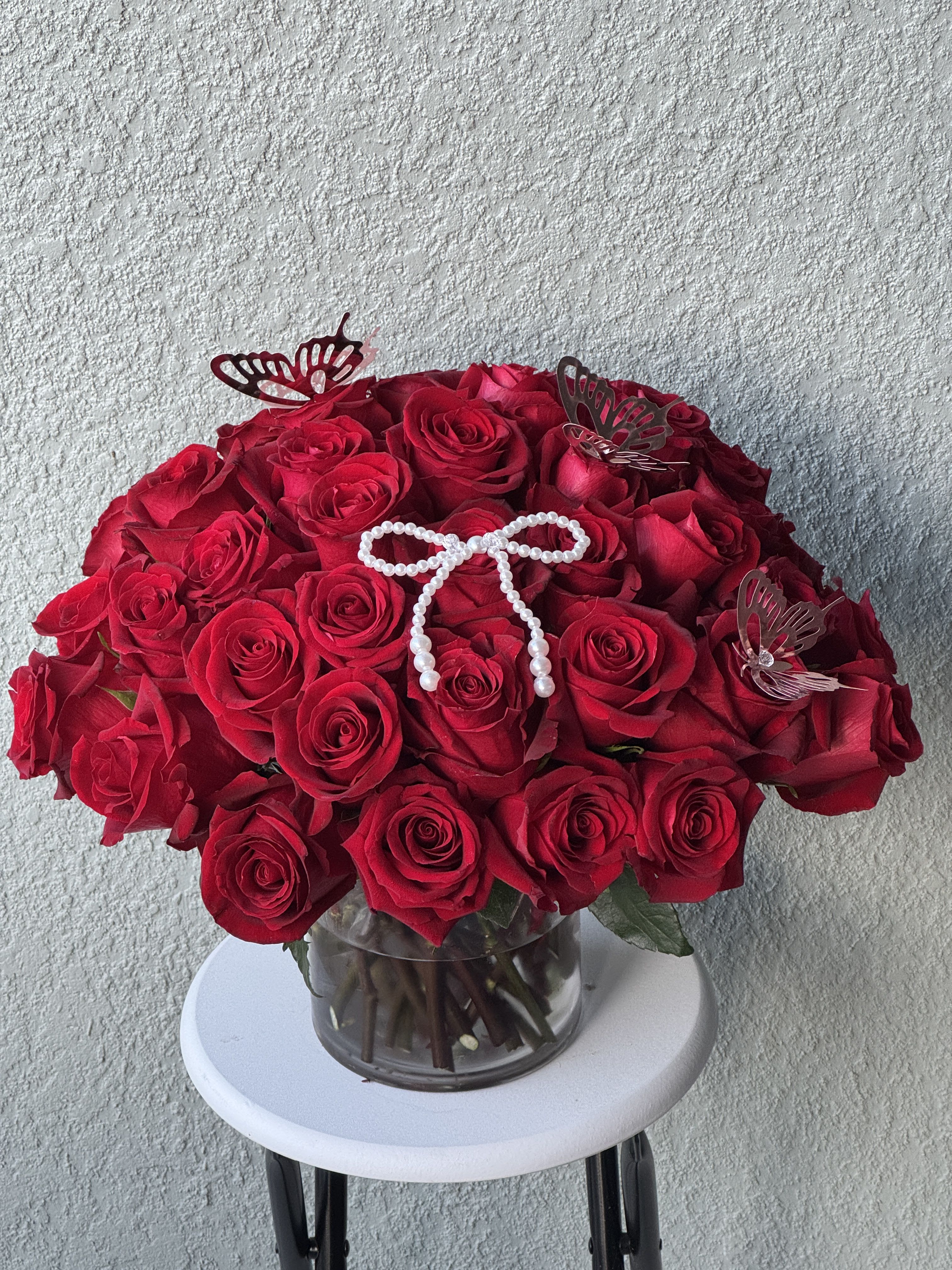 Three Dozen Red Roses - Make a bold statement with this beautifully simple design. Three Dozen Red Roses by BloomNation™ is the perfect gift for Valentine's Day, an Anniversary, or when anytime you're feeling romantic.   Arrangement Details: Three dozen red roses in a glass cylinder vase.  APPROXIMATE DIMENSIONS are 12"D X 12"H 