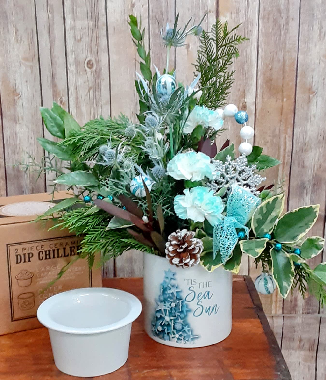 Tis The SEA SUN - Keepsake Dip Chill Container - --Perfect for Picnics, Parties, and Potlucks. Just Fill Bottom with Ice or Gel Packs to Keep Dips or Spreads at the Perfect Temperature!! It is delivered to your loved one filled with Christmas Greenery and Festive Flowers. This is a Gift that Everyone will enjoy!!!! *Material - Ceramic *Holds Over 2 Cups of Your Favorite Dip *Reads "'Tis the Sea Sun" on the Side  A box for storage is included.  *This design is sustainable and environmentally friendly