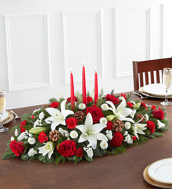Traditional Christmas centerpiece - Centerpiece of evergreens, white lilies, red roses, carnations, and mums