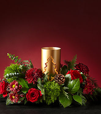 THROUGH THE WOODS CENTERPIECE - EVERGREEN ARRANGEMENT WITH A GOLDEN HURRICANE TRIMMED WITH RED ROSES, RED MUMS  AND PINE CONES