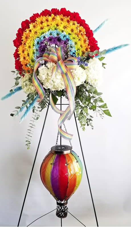 Rainbow Standing Spray with Solar Hot Air Ballon - Flowers and solar balloon subject to substitution and availability.