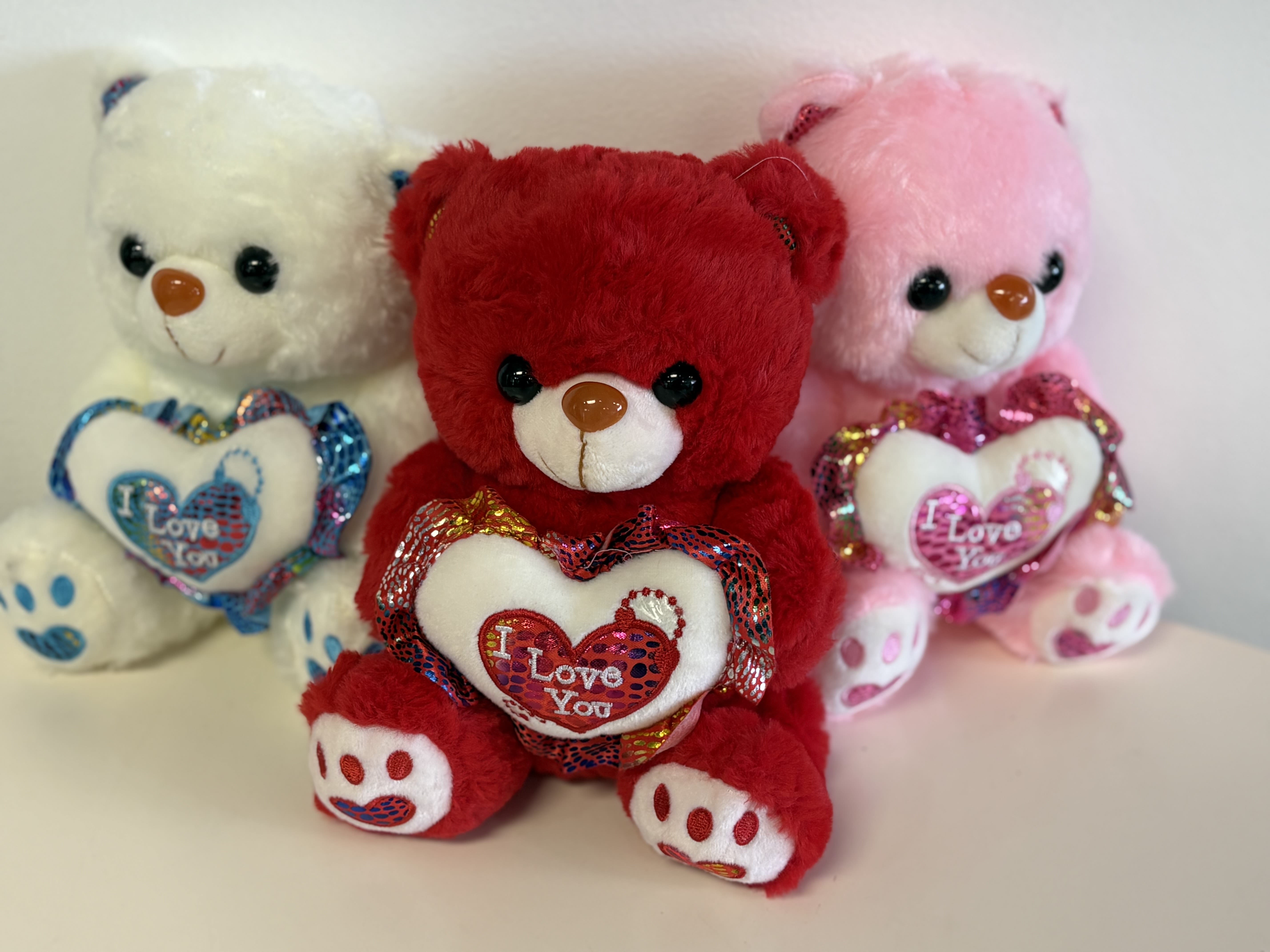 Teddy Bear  - A soft and adorable bear that is ready for a new home!  Small / Standard - 10" Medium / Deluxe - 11.8" Large / Premium - 16"  *Request bear color in the florist notes section (step 3 of checkout): red, white, or pink   Want something bigger? Search for our Jumbo Bear (3 feet!)