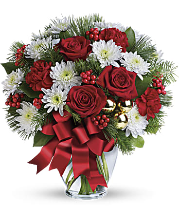 Merry Beautiful Bouquet - So very merry! Spread holiday cheer far and near with this festive mix of classic Christmas roses, winter forest greens and sparkling golden ornaments. This festive mix includes red roses, white cushion spray chrysanthemums, red carnations, white pine, douglas fir, lemon leaf, red berries and gold ornament balls. Delivered in a glass ginger vase adorned with red ribbon.