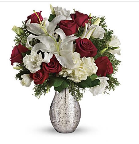 A Christmas Kiss by Teleflora - Capture the romance of the season! Wonderful white hydrangea and rich red roses fill our stunning silver mercury glass royal vase. White hydrangea, red roses, white oriental lilies and white lisianthus are accented with flat cedar. Delivered in Teleflora's silver mercury glass royal vase. Orientation: All-Around