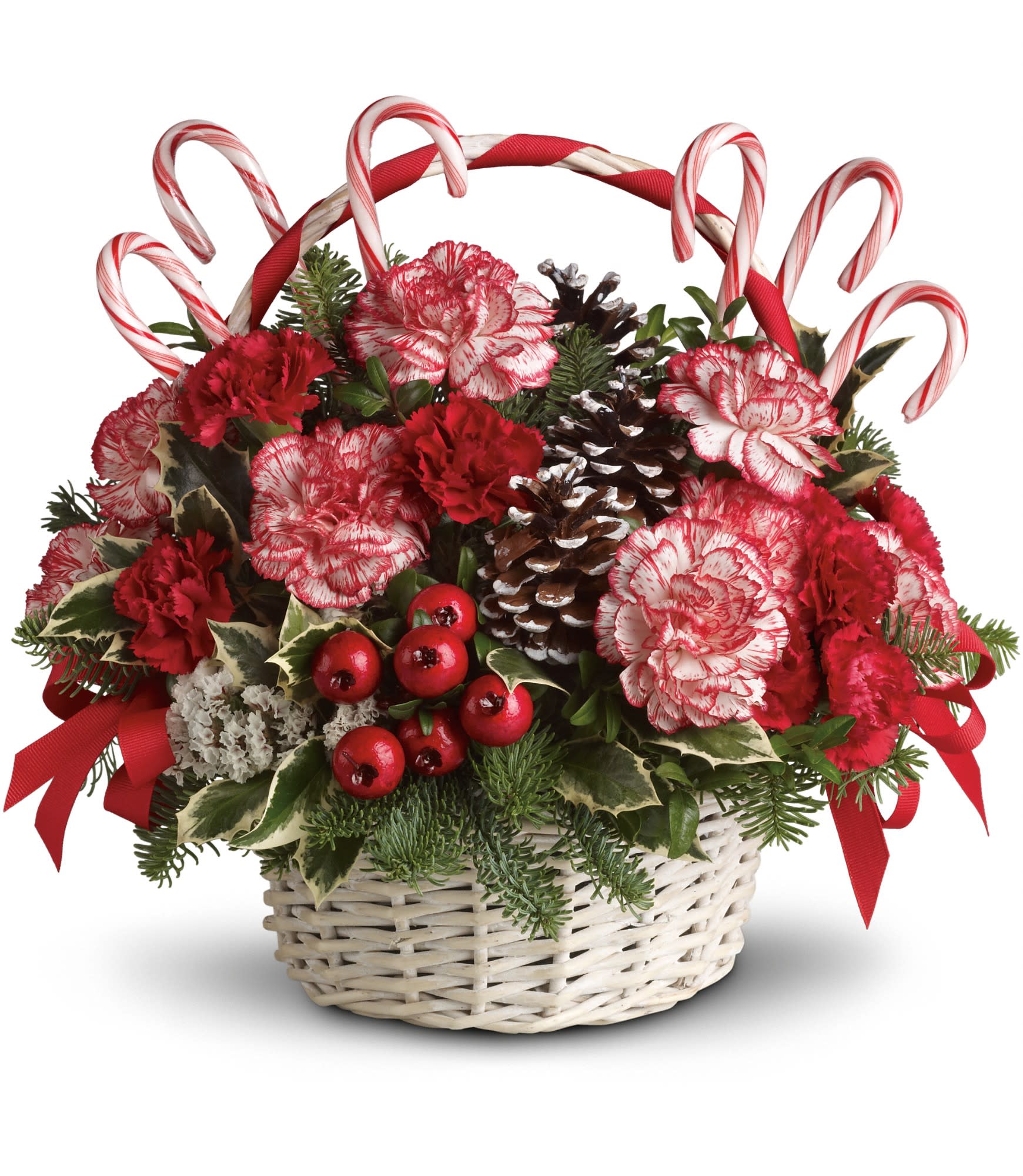 Candy Cane Christmas - A-tisket, a-tasket, a candy cane Christmas basket. What fun it will be when this cheery basketful of holiday joy gets delivered!  Peppermint and red carnations, pinecones, berries, and ribbon are delightfully placed in a white wicker basket. Real candy canes make this an extra sweet gift. 