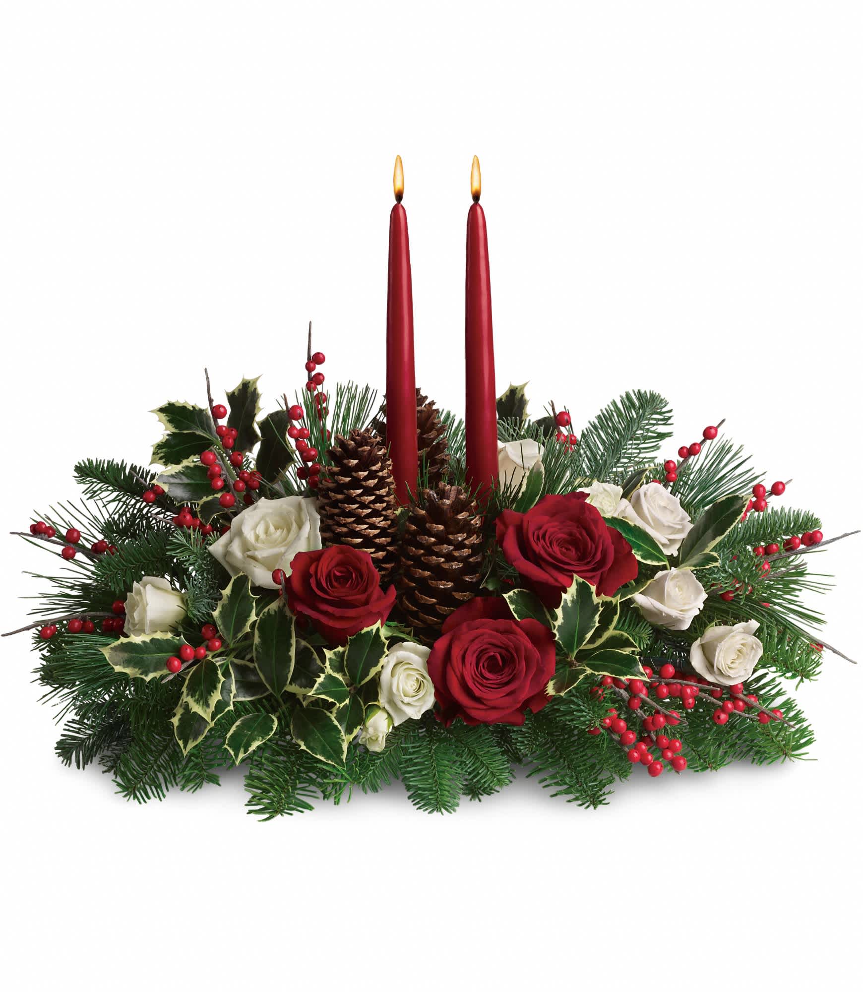 Christmas Wishes Centerpiece - Elegant. Lovely. Radiant. This beautiful Christmas centerpiece is everything you could wish for and more.  Stunning red and white roses, white spray roses and chrysanthemums plus all of your holiday favorites like pinecones, berries, Christmas greenery and two tall-tapered candles. A brilliant way to send your Christmas wishes in style.  