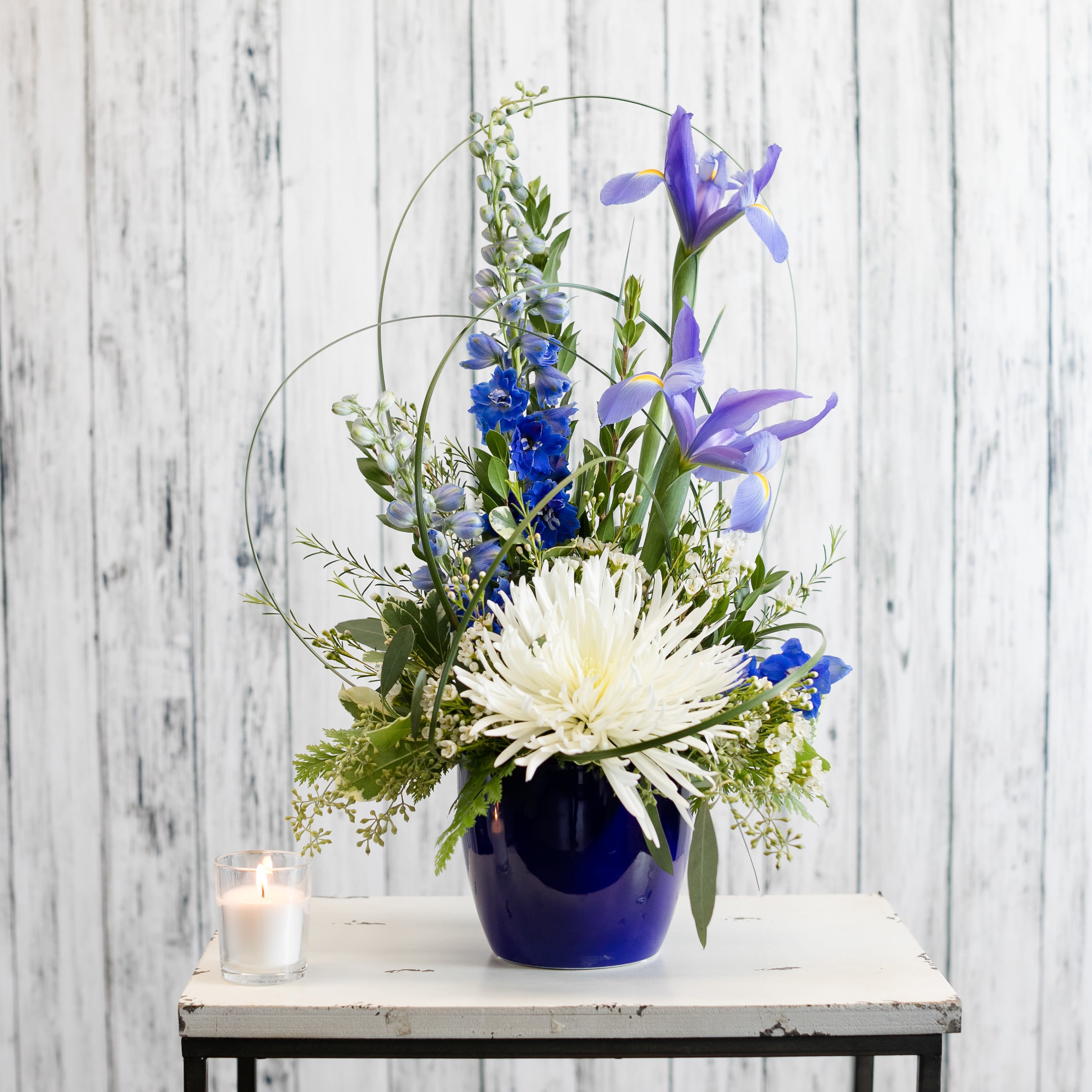 Cobalt - Soothing blue and white blooms are given a contemporary twist in a rich blue ceramic.  Approximate Dimensions: 16" H X 11 " W