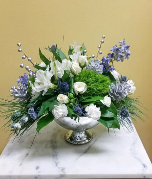 Hanukkah Sameach! - Beautifully designed mercury silver bowl with stunning blue accents. Inspired by winter’s cool blue &amp; white colors, our delightful arrangement delivers warm wishes to the people you love.