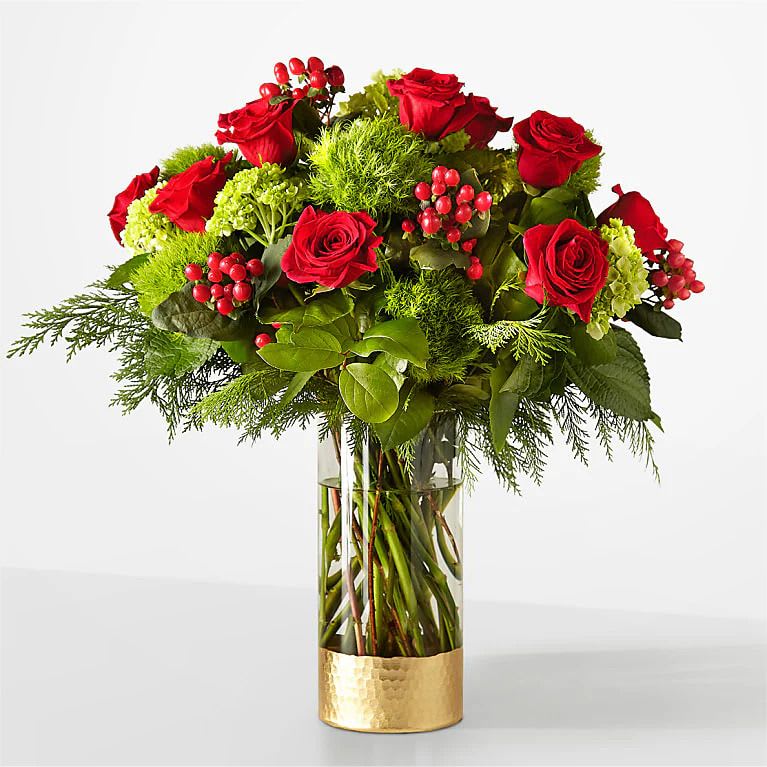 Plaid Throw Bouquet - Cozy up with these traditional red and green blooms, a timeless gift for every occasion. Details  Designed by florists, ready to display. For long–lasting blooms, replace the water daily. We suggest trimming the stems every couple days. Pet Safety Precautions: This bouquet or plant may include flowers and foliage that are known to be toxic to pets. To keep them safe, be sure to keep this arrangement out of your pet's reach. Bloom Details Rose Hypericum Berry Carnation Hydrangea Christmas Greens