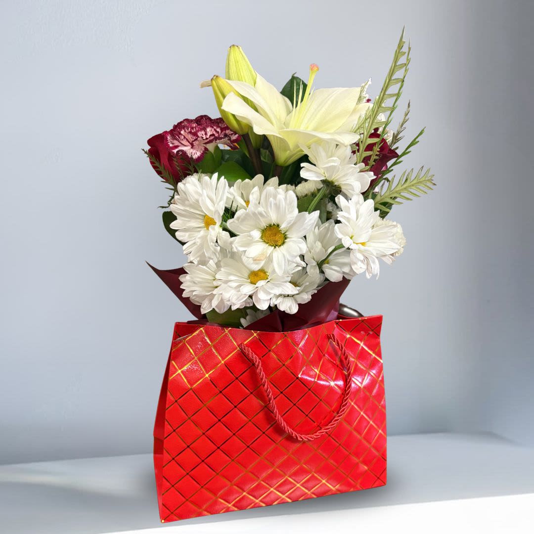LOCAL OFFER- Flower Wrap Gift Bag - Get 50% off signature wraps! Use code: TAKEOFF50 at checkout  Our signature wraps includes our best, seasonal standard flowers designed and wrapped in paper and ribbon in a gift bag. Available for pick-up in-store only.  (See hand-held bouquet for $45 value or more bouquet)