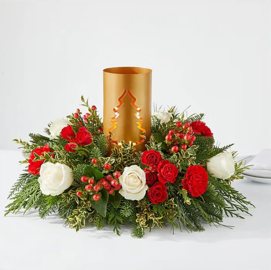 December Dreams Centerpiece - Tis the season for gathering with family and friends, made all the sweeter with a stunning and scented centerpiece at the heart of the table. Details  Designed by florists, ready to display. For long–lasting blooms, add water daily. Pet Safety Precautions: This bouquet or plant may include flowers and foliage that are known to be toxic to pets. To keep them safe, be sure to keep this arrangement out of your pet's reach. Bloom Details Carnation Rose Christmas Greens Hypericum Berry