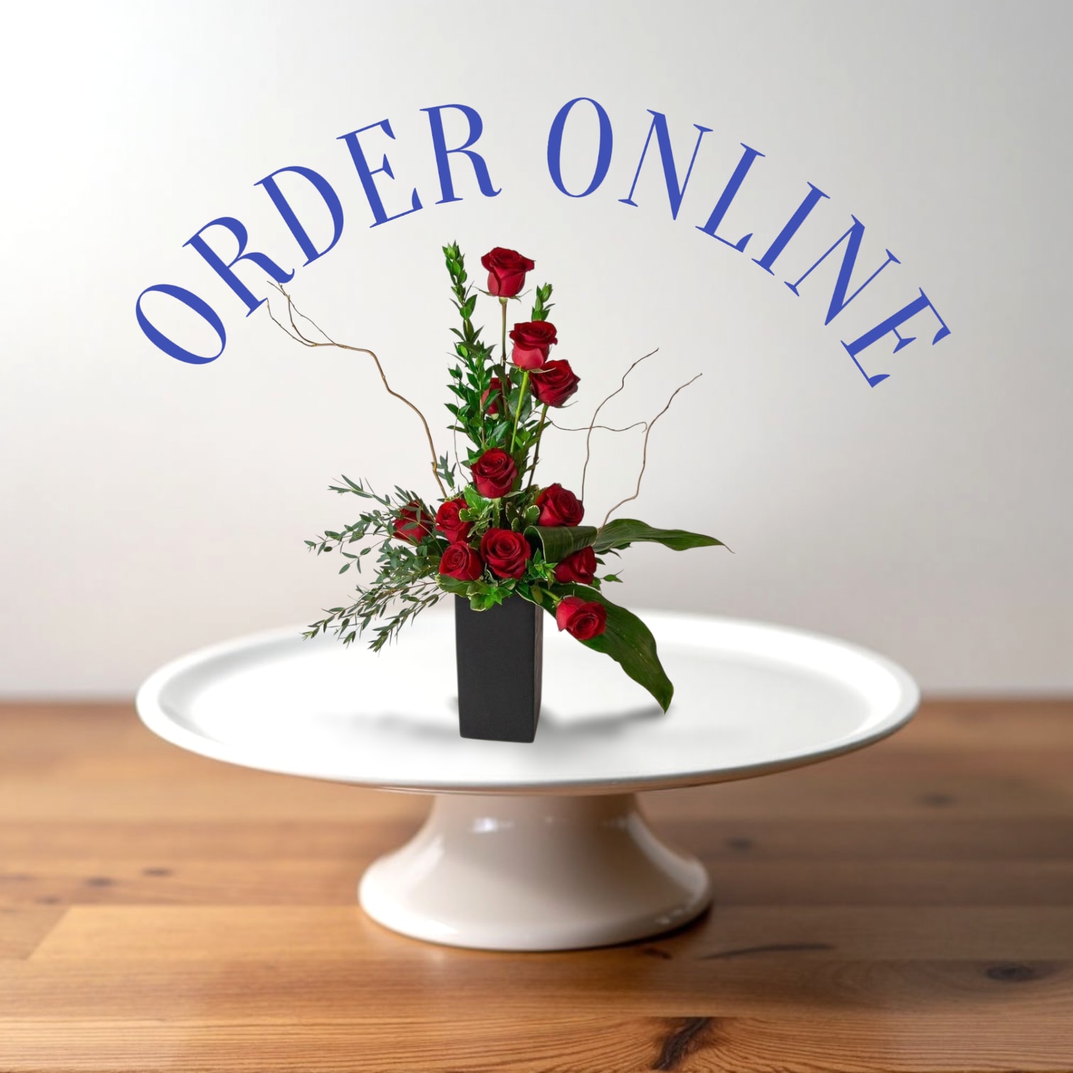 Elegant Devotion - Lush red roses paired with fresh greenery in a minimalist design that speaks timeless passion.