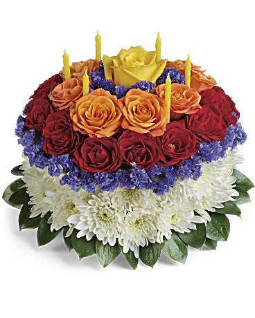 Birthday Wishes flower cake - Birthday Wishes flower cake Sweet as a birthday cake, this creative, colorful bouquet of roses and mums, topped with birthday candles, is sure to delight them on their special day! This cake-inspired floral arrangement is not intended for consumption. Birthday Wishes flower cake  This cute cake arrangement is made up of yellow roses, orange and red spray roses, white cushion spray chrysanthemums, statice, and greenery. Birthday Wishes flower cake  Please note the bouquet pictured reflects our original design.  If the exact flowers or container in this arrangement are not available, our local florists will create a beautiful bouquet with the freshest available flowers. #Birthdayflowercake #birthdaysurprise, #saydaydeliverery #brightflowers, #happybirthday