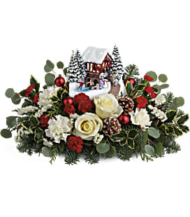 T18X205A Thomas Kinkade’s Christmas Bridge Bouquet - Set your course for festive fun with this lush Christmas bouquet, hand-delivered with a light-up, hand-painted Thomas Kinkade sculpture that's sure to become a holiday décor favorite!