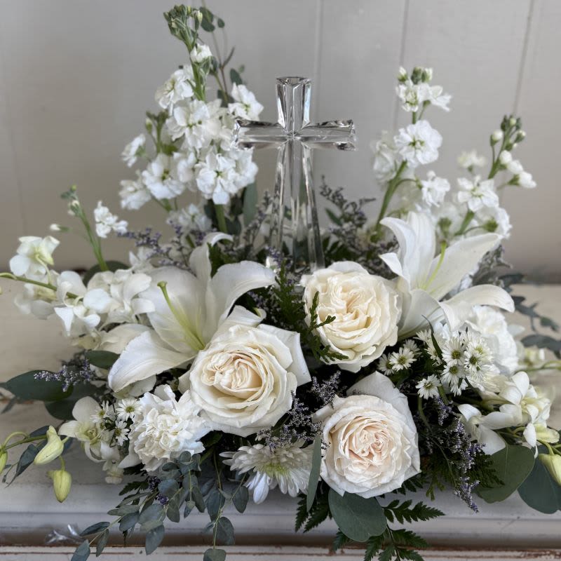 Peaceful Crystal Cross - An elegant display of faith and divine peace, this beautiful arrangement will comfort the bereaved in a truly thoughtful and respectful way. An exquisite crystal cross is surrounded by a bed of lovely blossoms. It is sure to be appreciated and always remembered.  