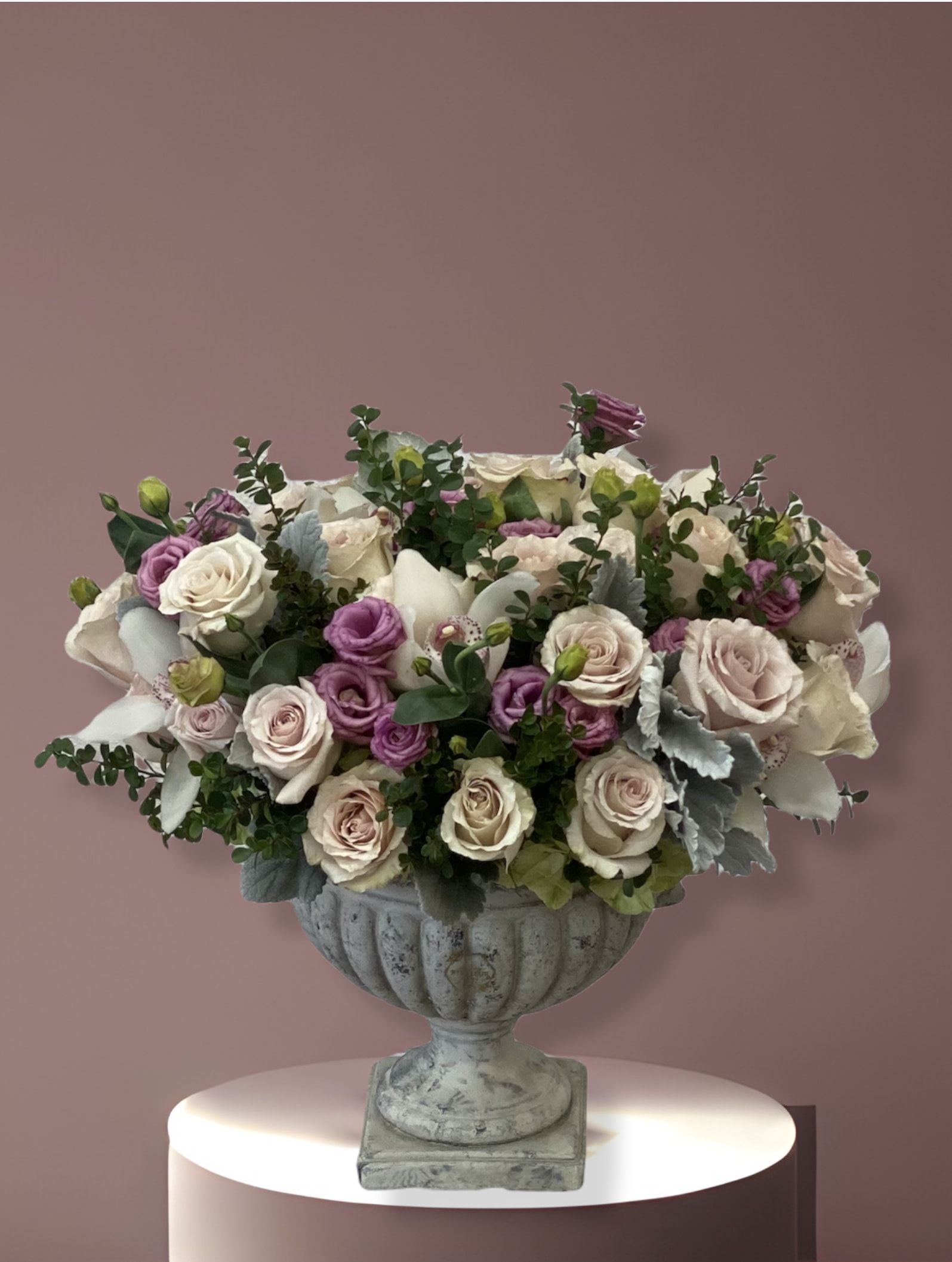 Love garden - This arrangement comes in a clay vase filled with the following florals; roses, orchids etc. 